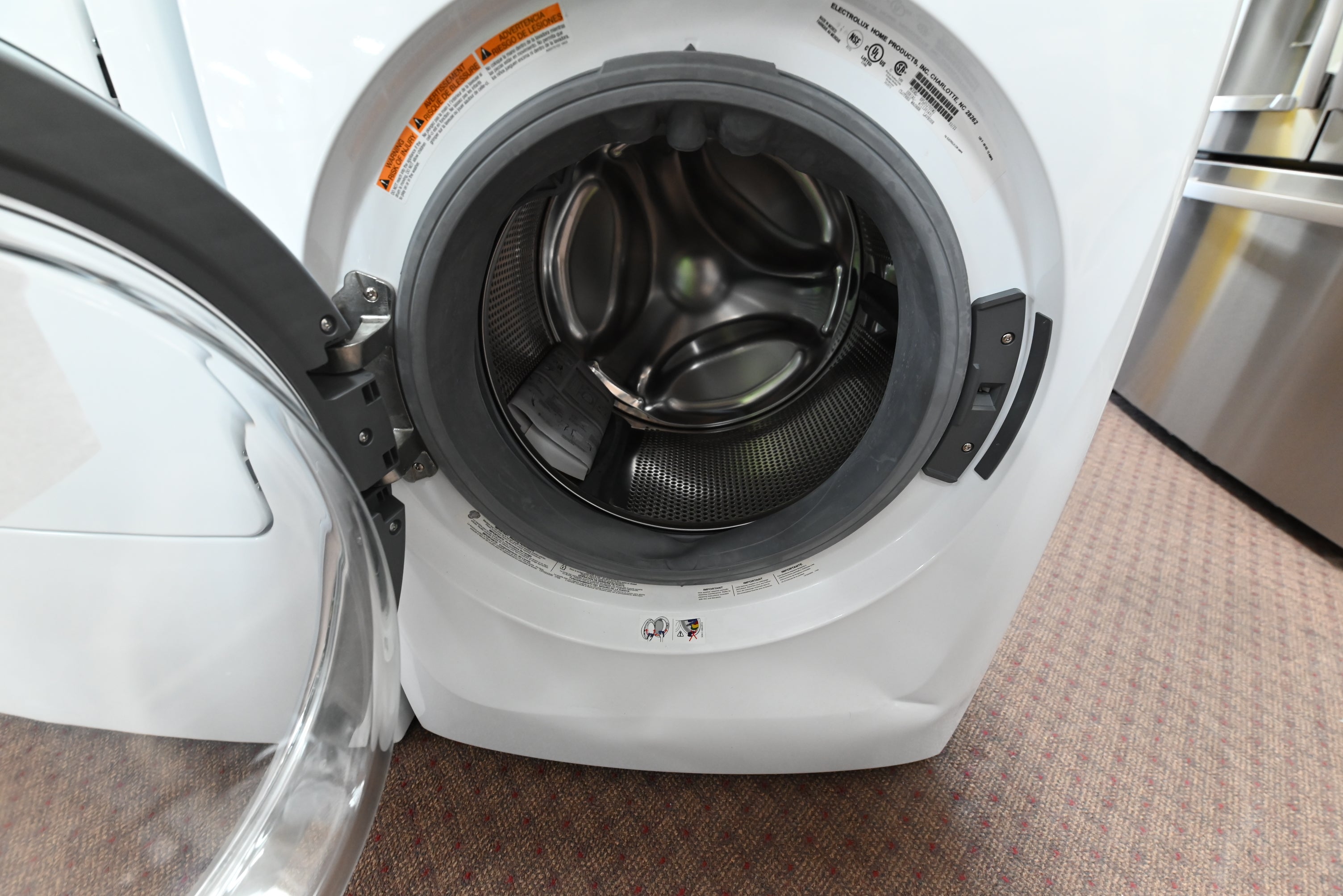 Close up view of the electronic control dial and LuxCare Steam options on the Electrolux washer