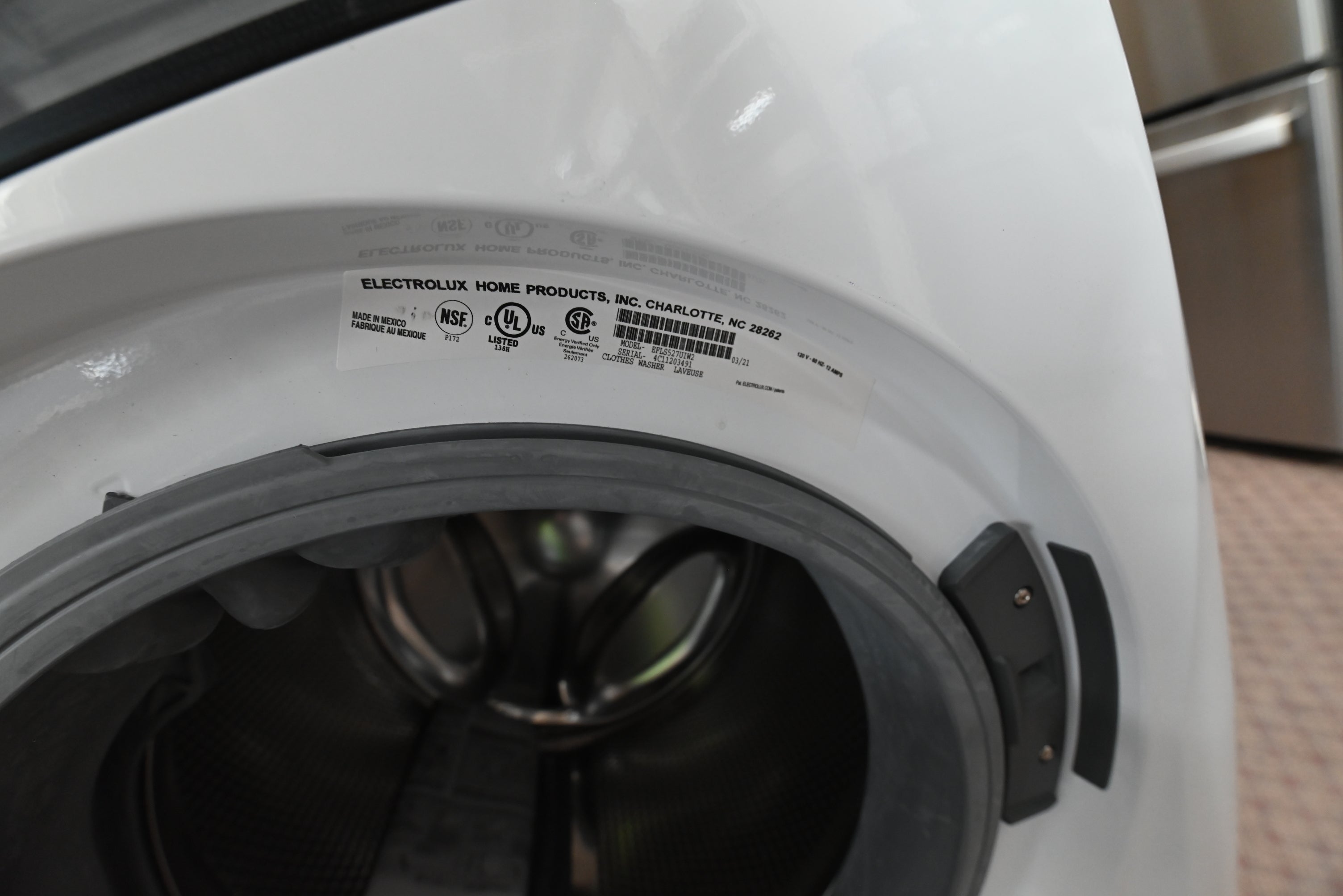 Electrolux 4.3 cu ft stainless steel washer drum open showing spacious interior