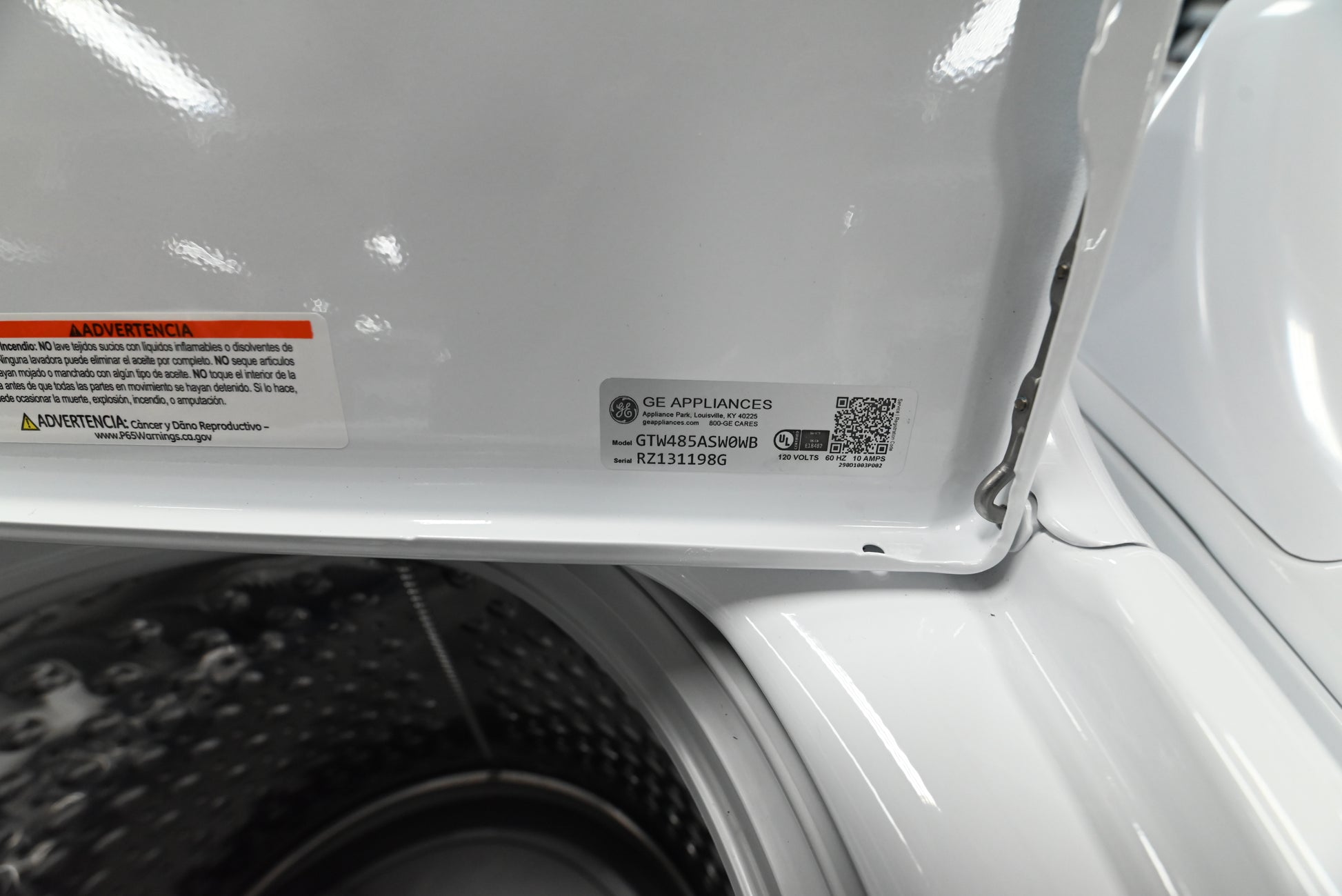 Detail view of the Wash Boost Cold Plus and Deep Fill control dials on the GE white washer