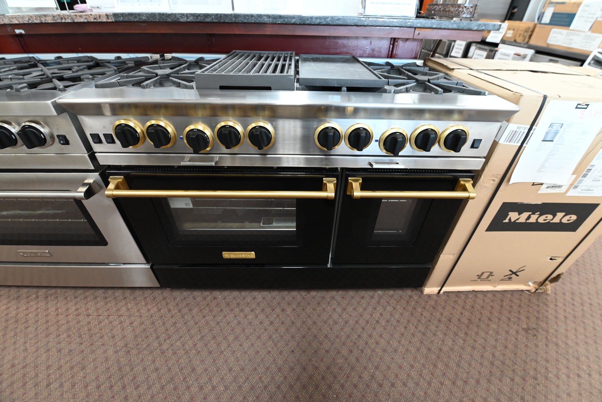 BSP488BCPLT 48 inch professional gas range front view in custom gloss black with polished brass trim