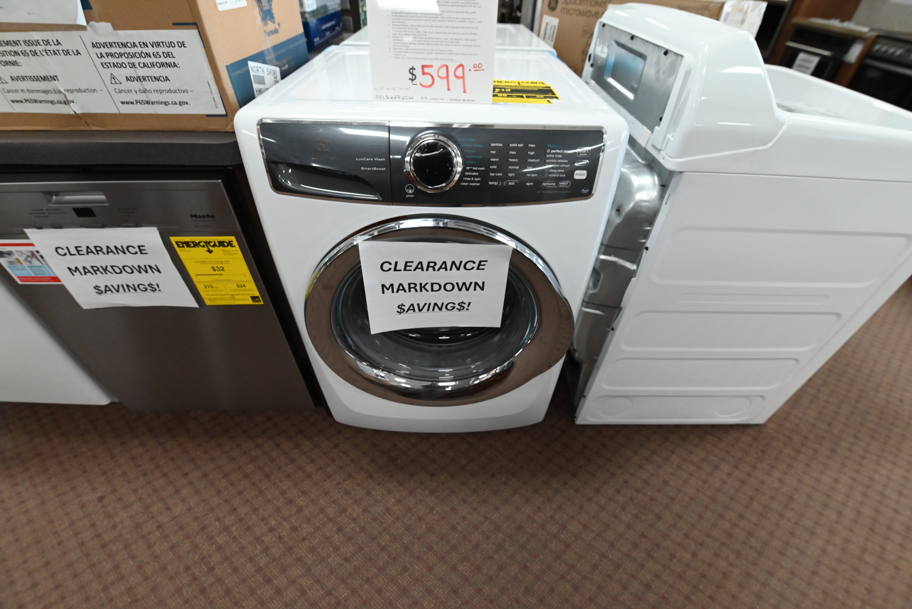 Electrolux 27 inch front load washer in island white with chrome door accent EFLS627UIW