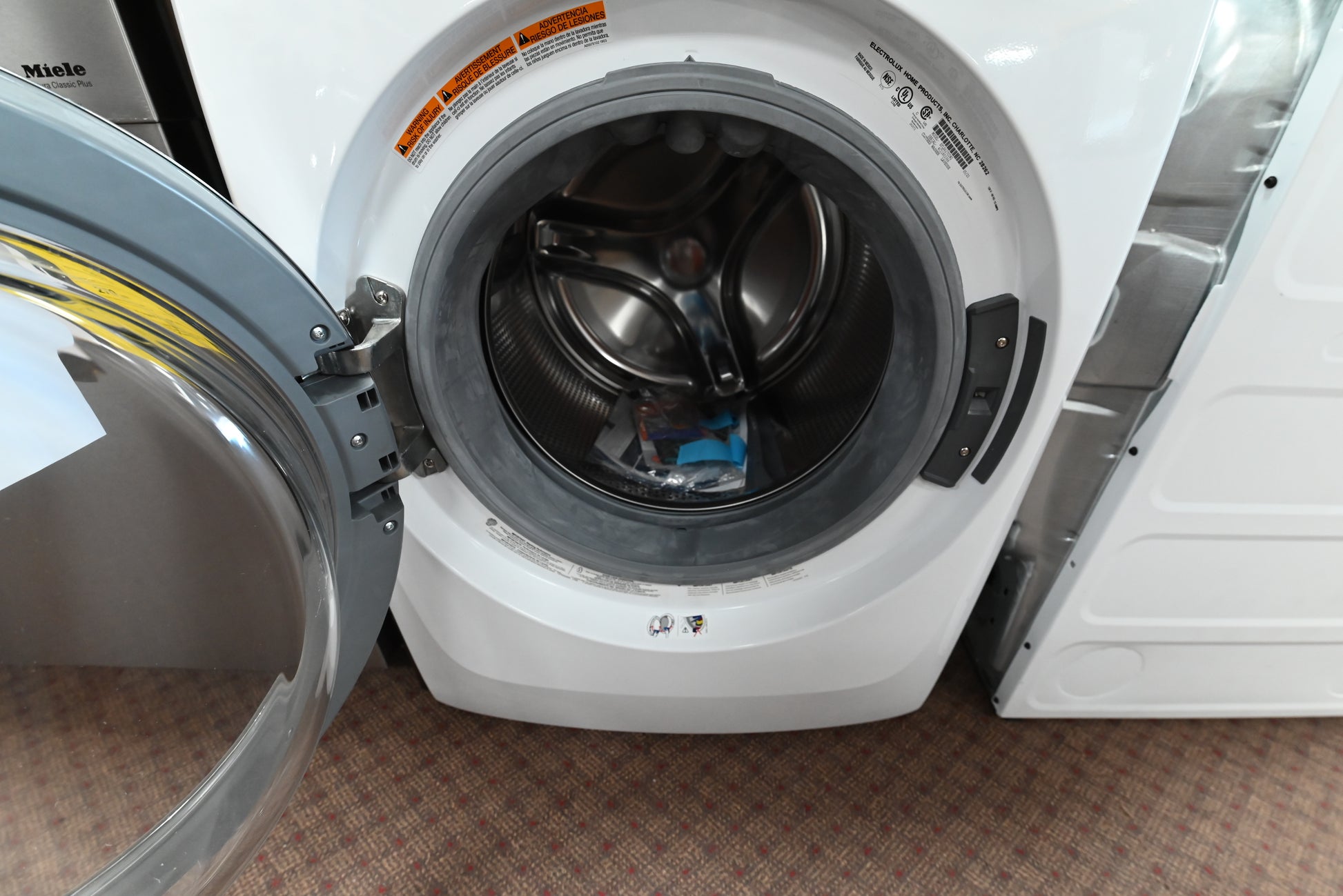 Close up view of the electronic control dial and SmartBoost detergent dispenser on the Electrolux washer