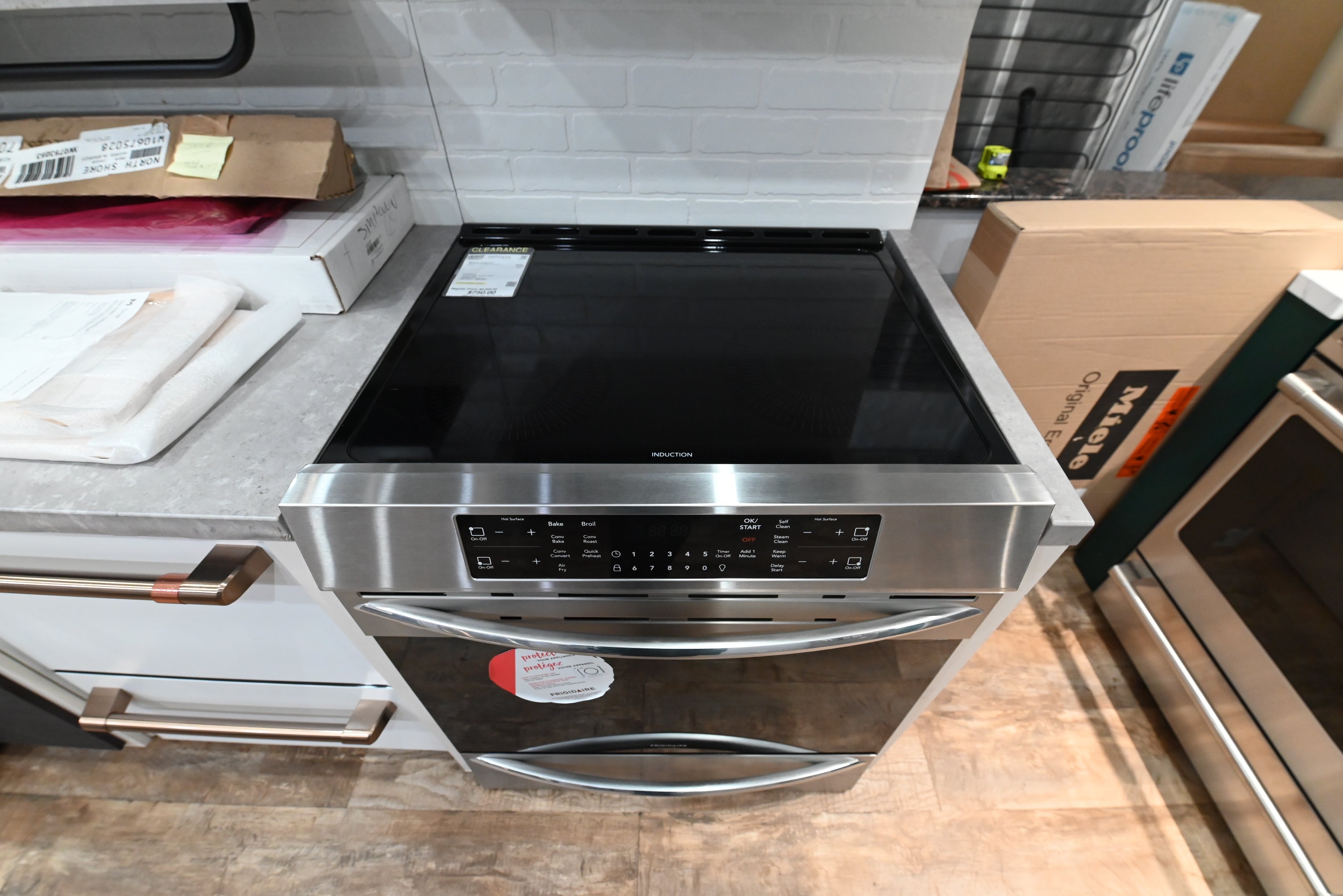 Close up view of the black ceramic glass induction cooktop on a Frigidaire Gallery FGIH3047VF range