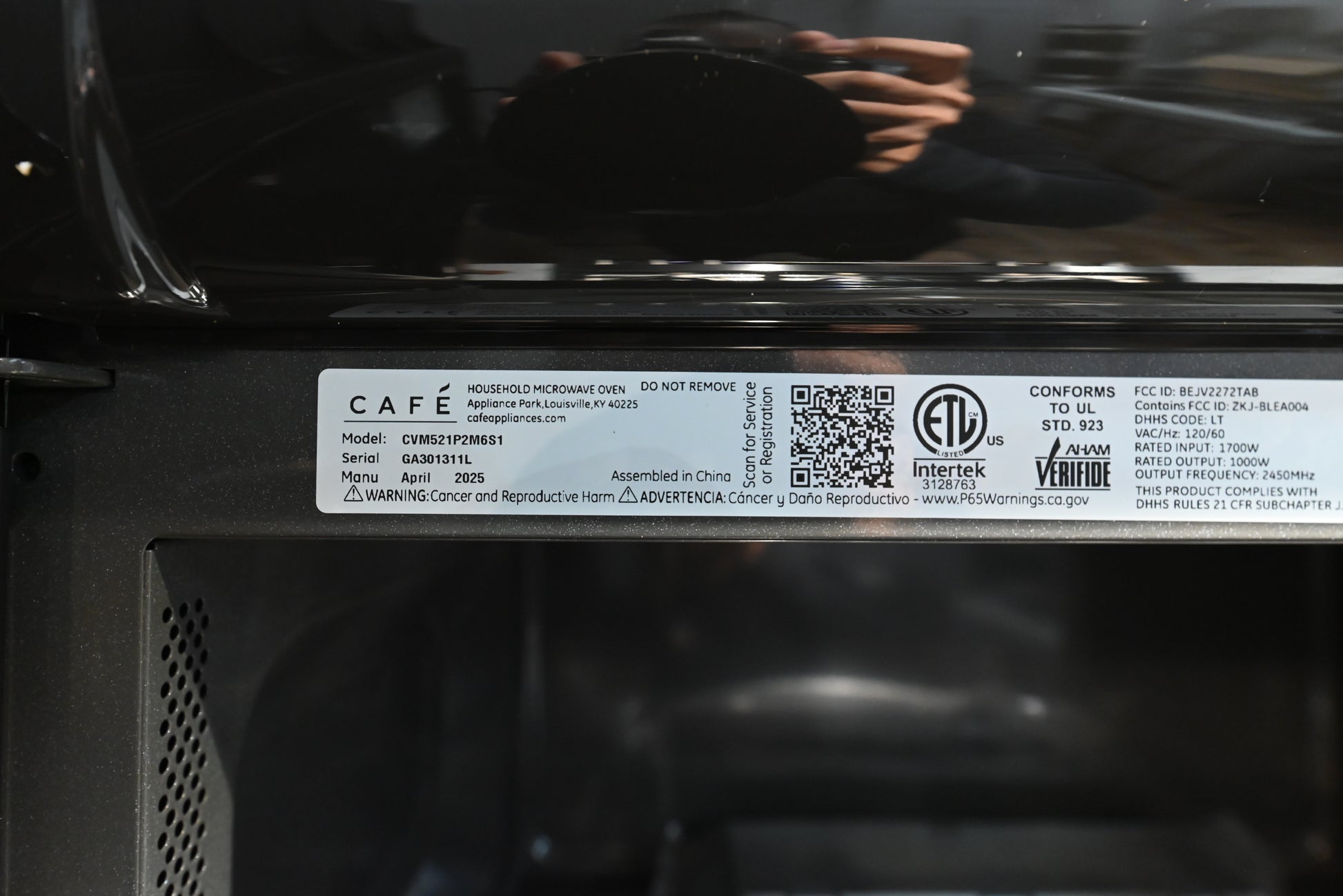 Cafe smart microwave showing open door and spacious dark enamel interior cavity