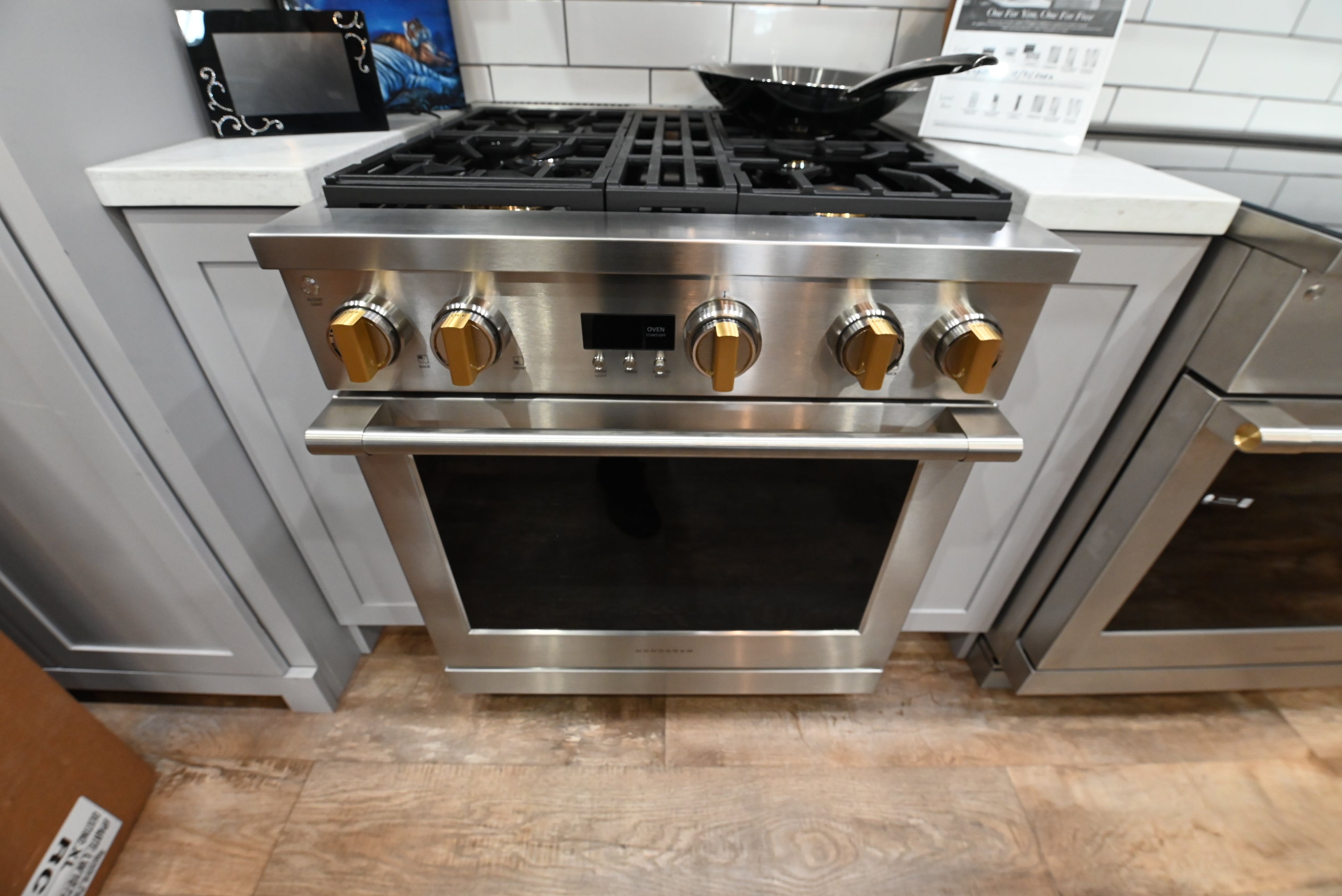 Monogram ZGP304NTSS 30 inch all gas professional range in stainless steel with signature brass accents on the knobs