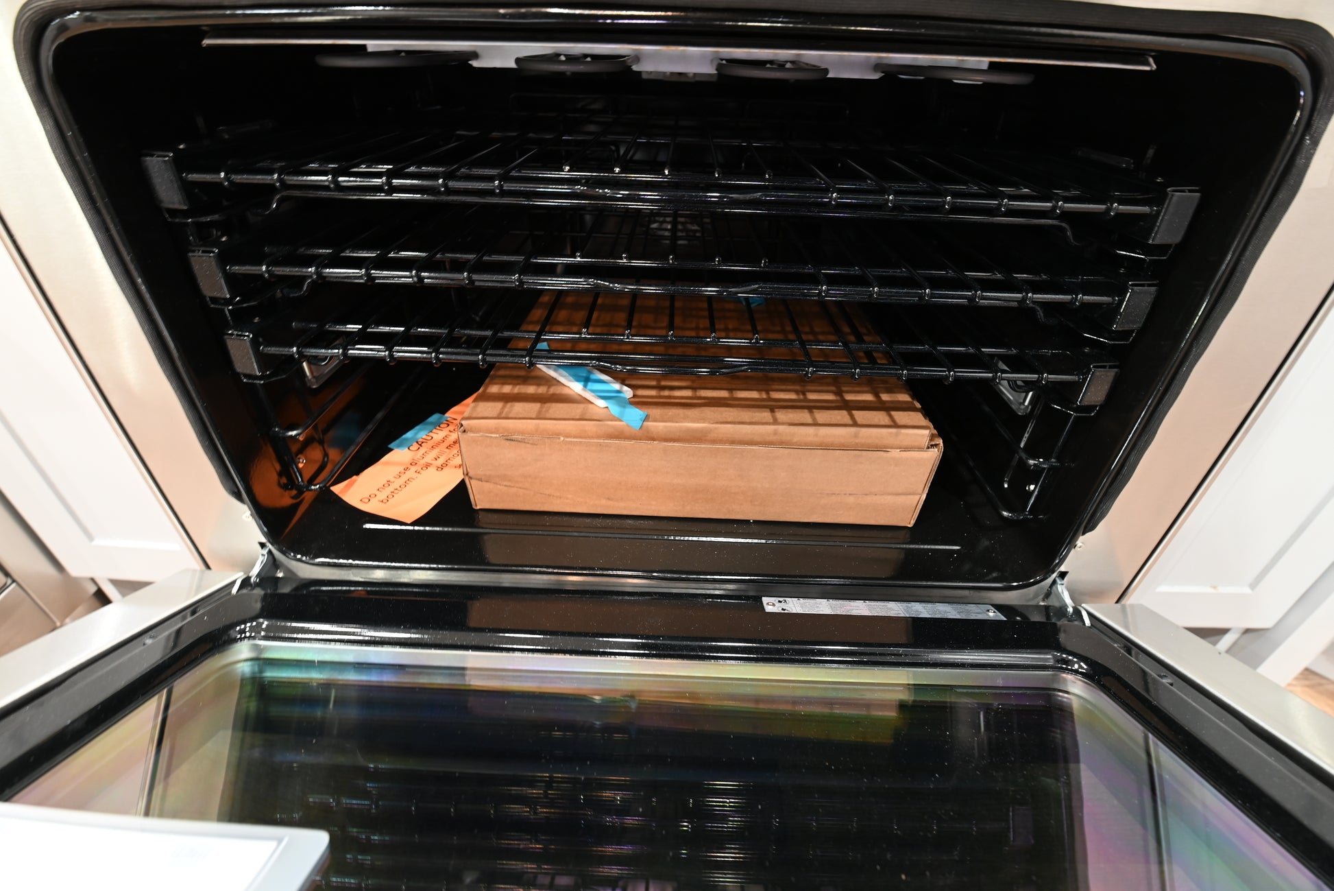 Close up view of the 7 inch articulating color touch LCD control panel on a Monogram 36 inch induction range