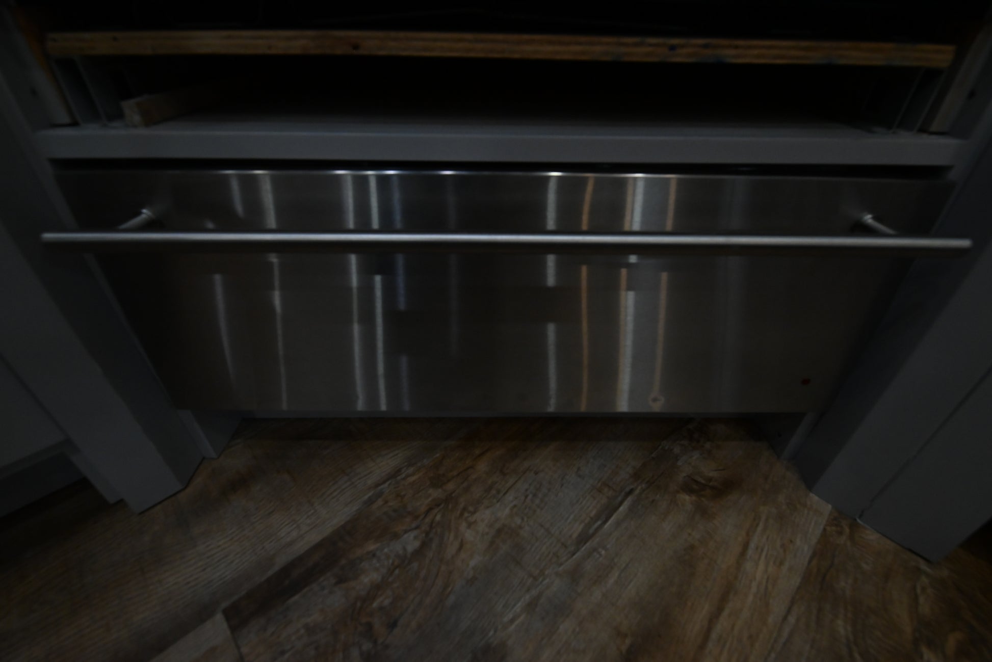 Monogram ZW9000SJSS 30 inch stainless steel warming drawer front view with pro-style tubular handle