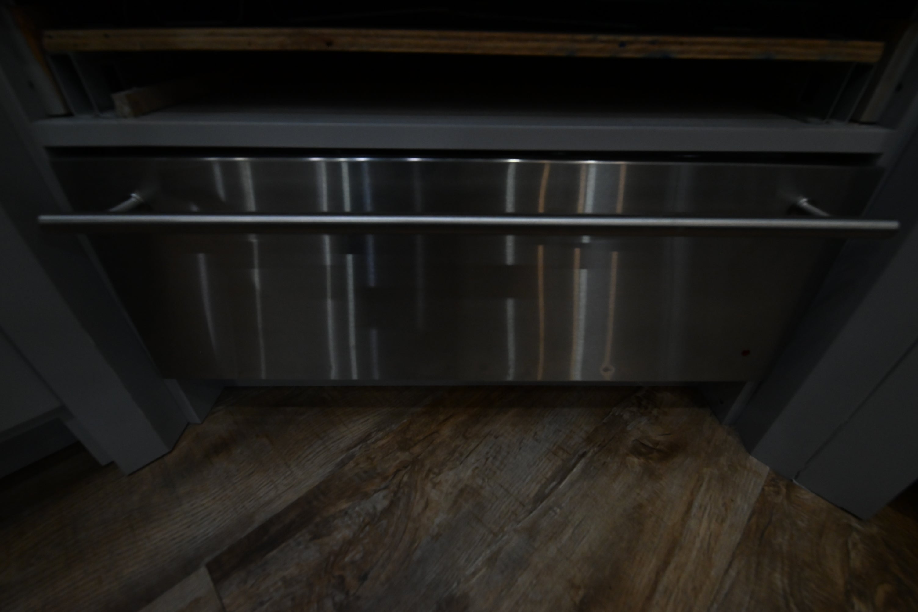Monogram ZW9000SJSS 30 inch stainless steel warming drawer front view with pro-style tubular handle
