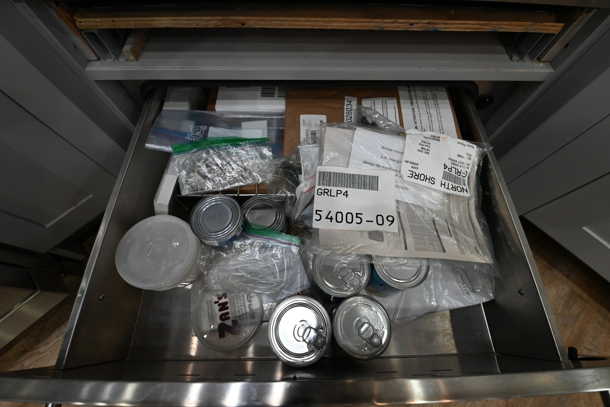 Open view of Monogram 30 inch warming drawer highlighting the internal half rack and variable humidity slider controls
