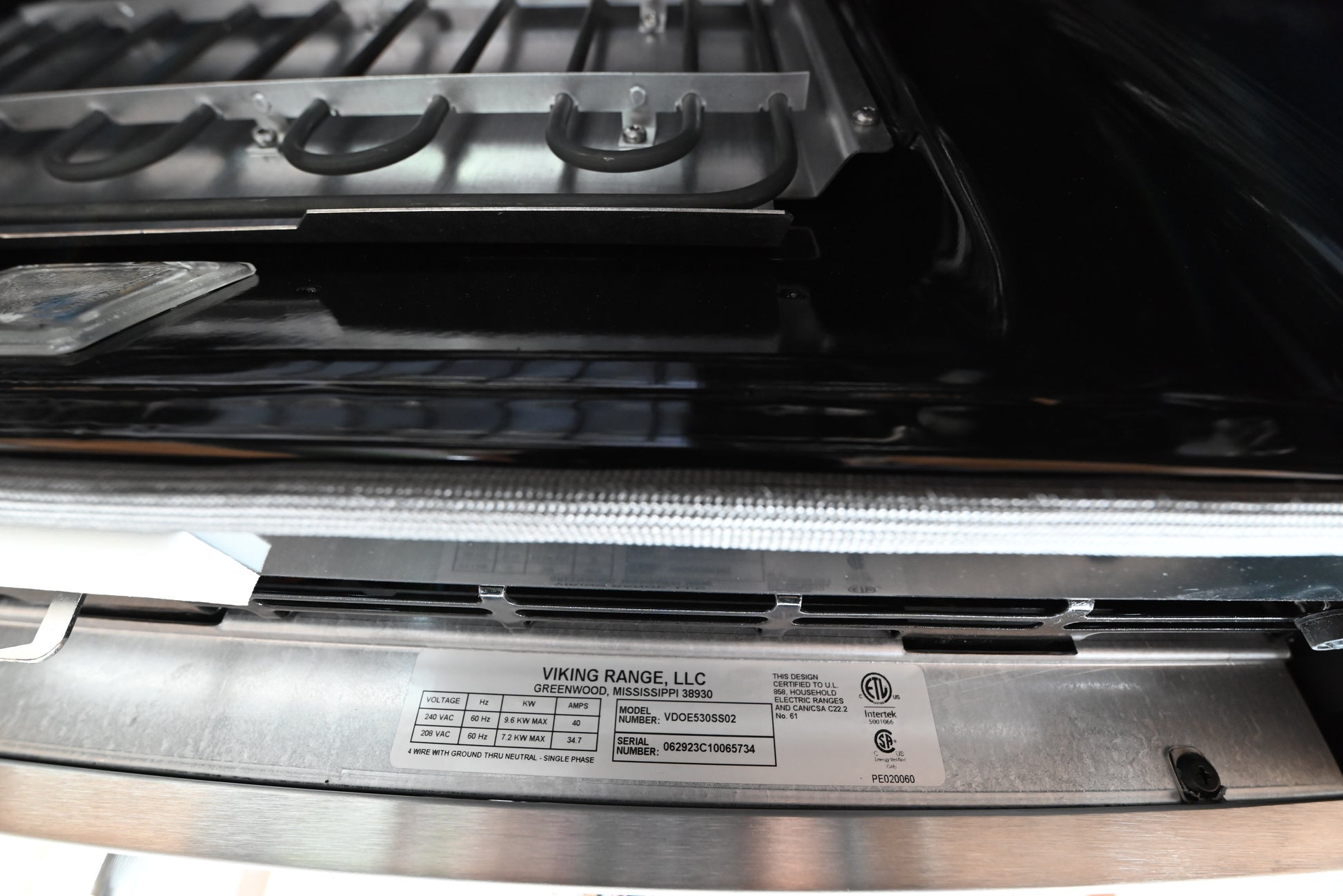 iking 30 professional double wall oven close up showing heavy analog control knobs and digital clock face