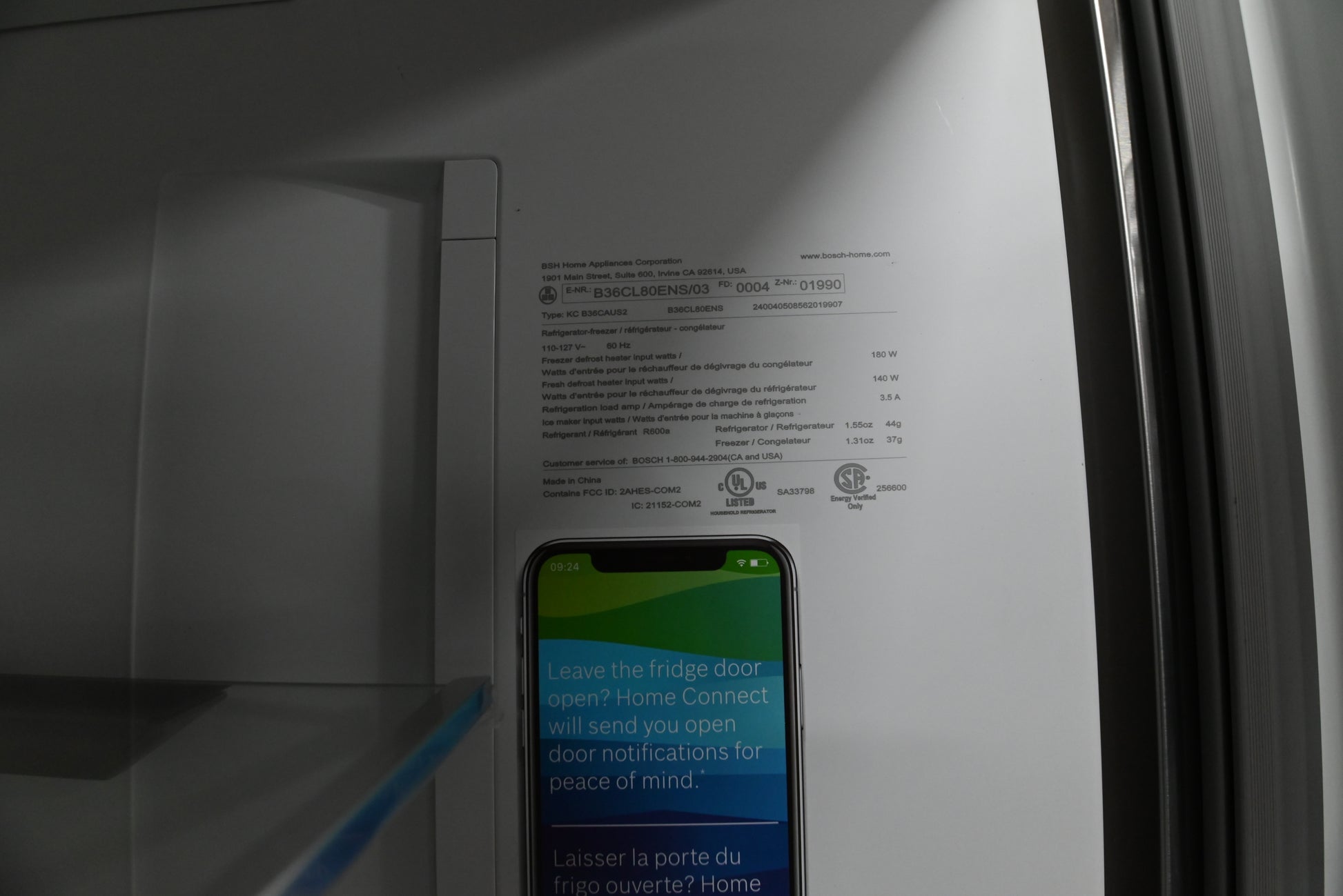 Bosch 36 refrigerator showing middle storage drawer and internal water dispenser tap