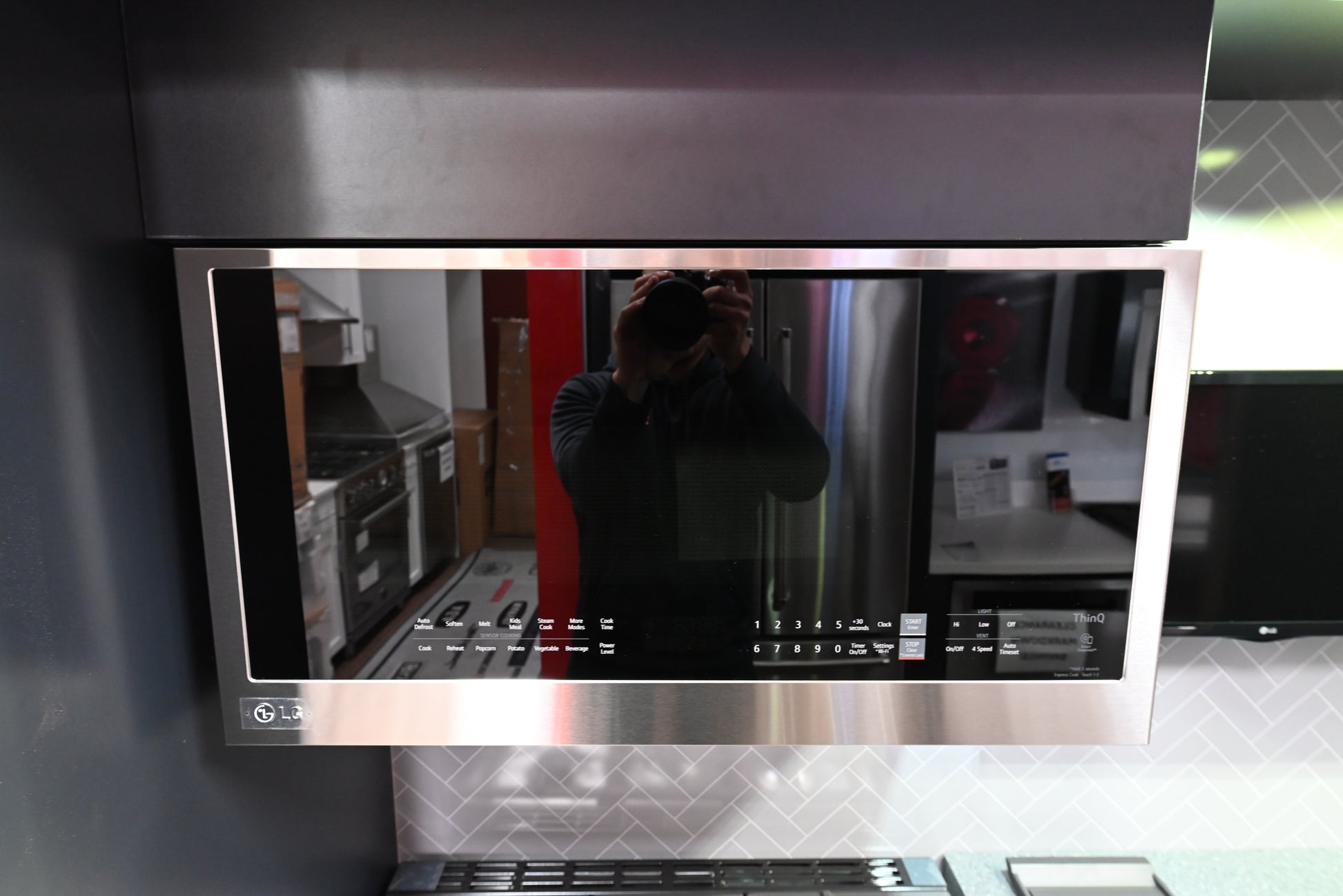 LG MVEL2033F 2.0 cu ft over the range microwave in fingerprint resistant stainless steel with a clean glass front door