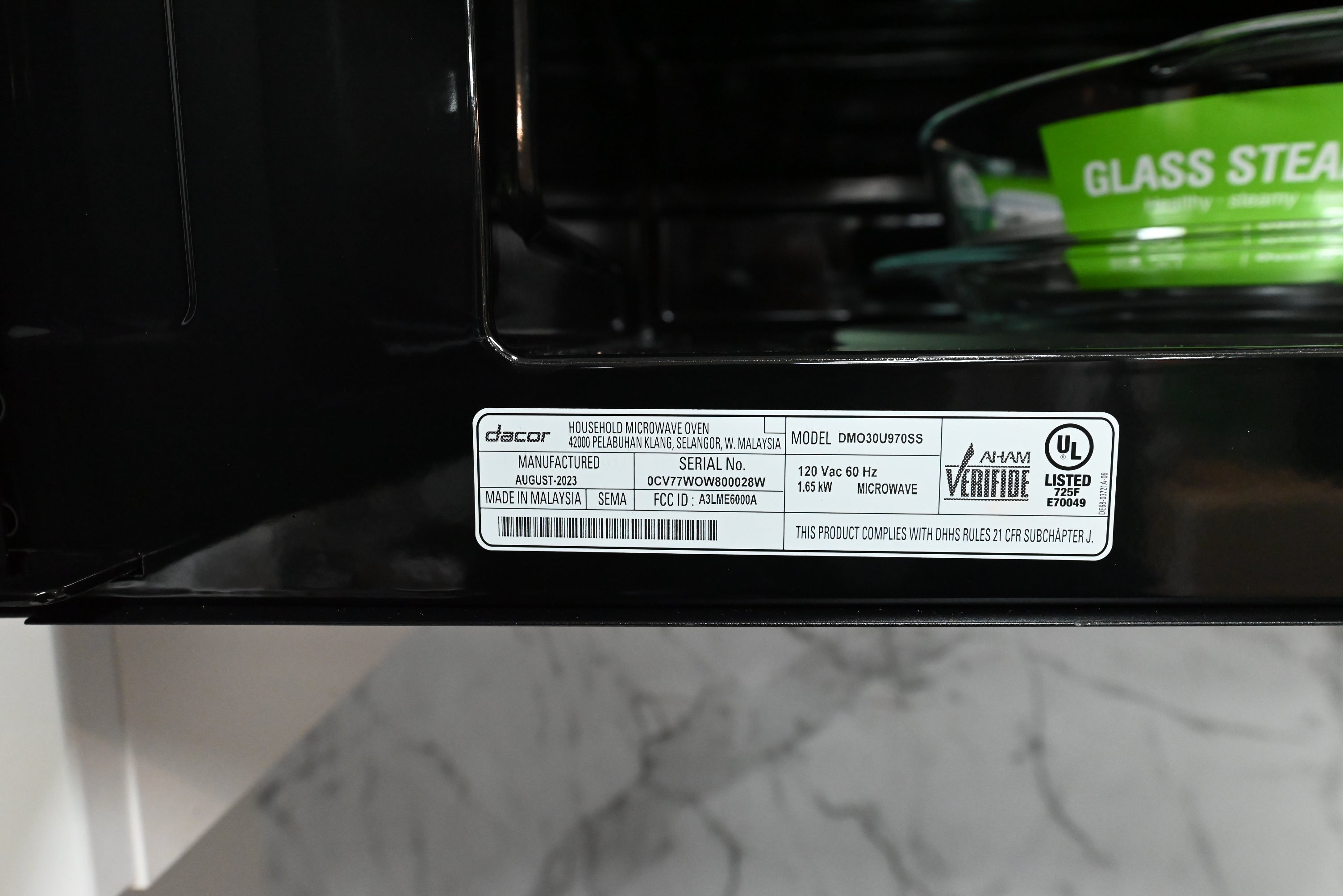 Dacor slim OTR smart microwave showing down firing LED cooktop light bar