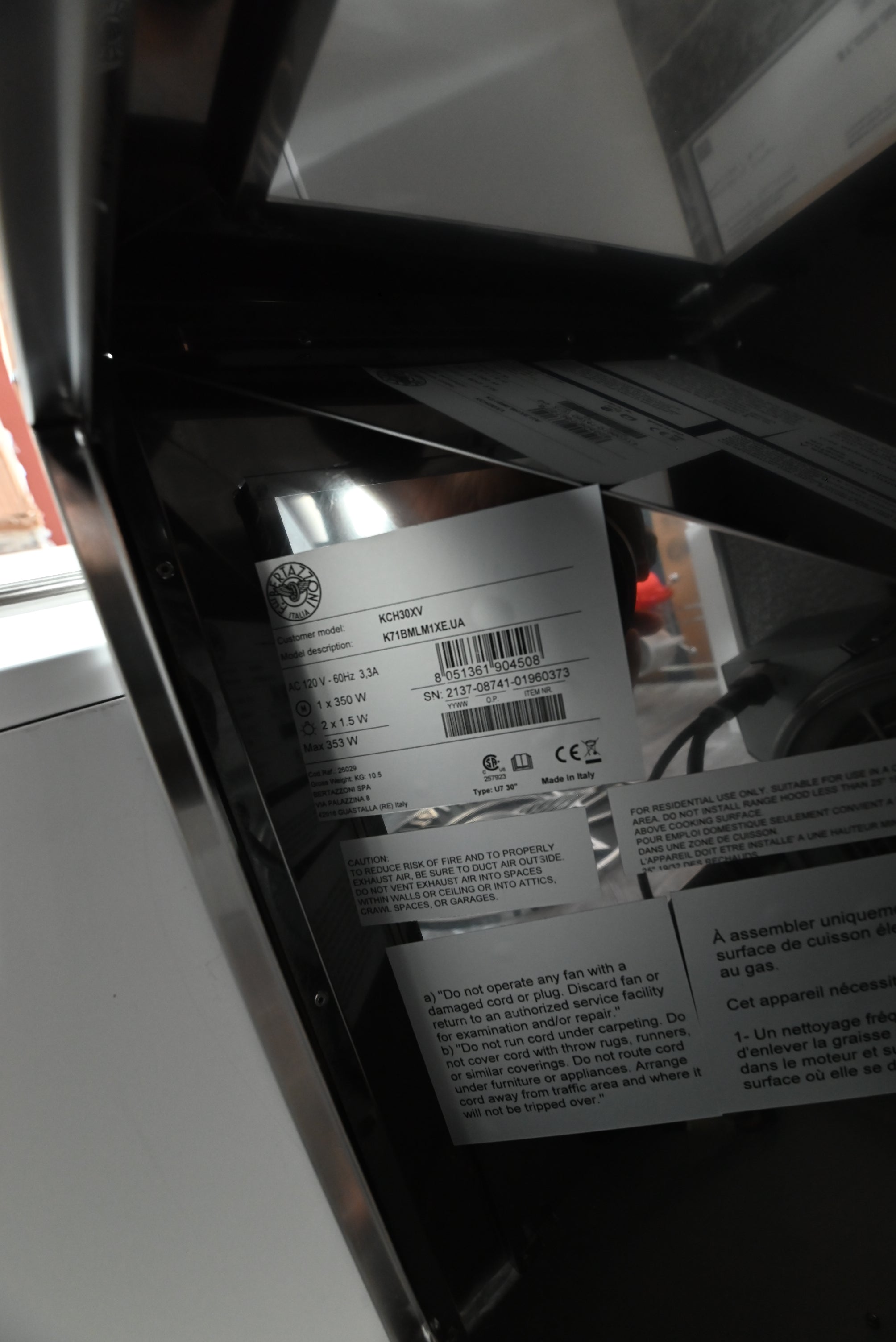 Luxury 30 inch Bertazzoni chimney hood showing under canopy aluminum mesh filters and dual LED lights
