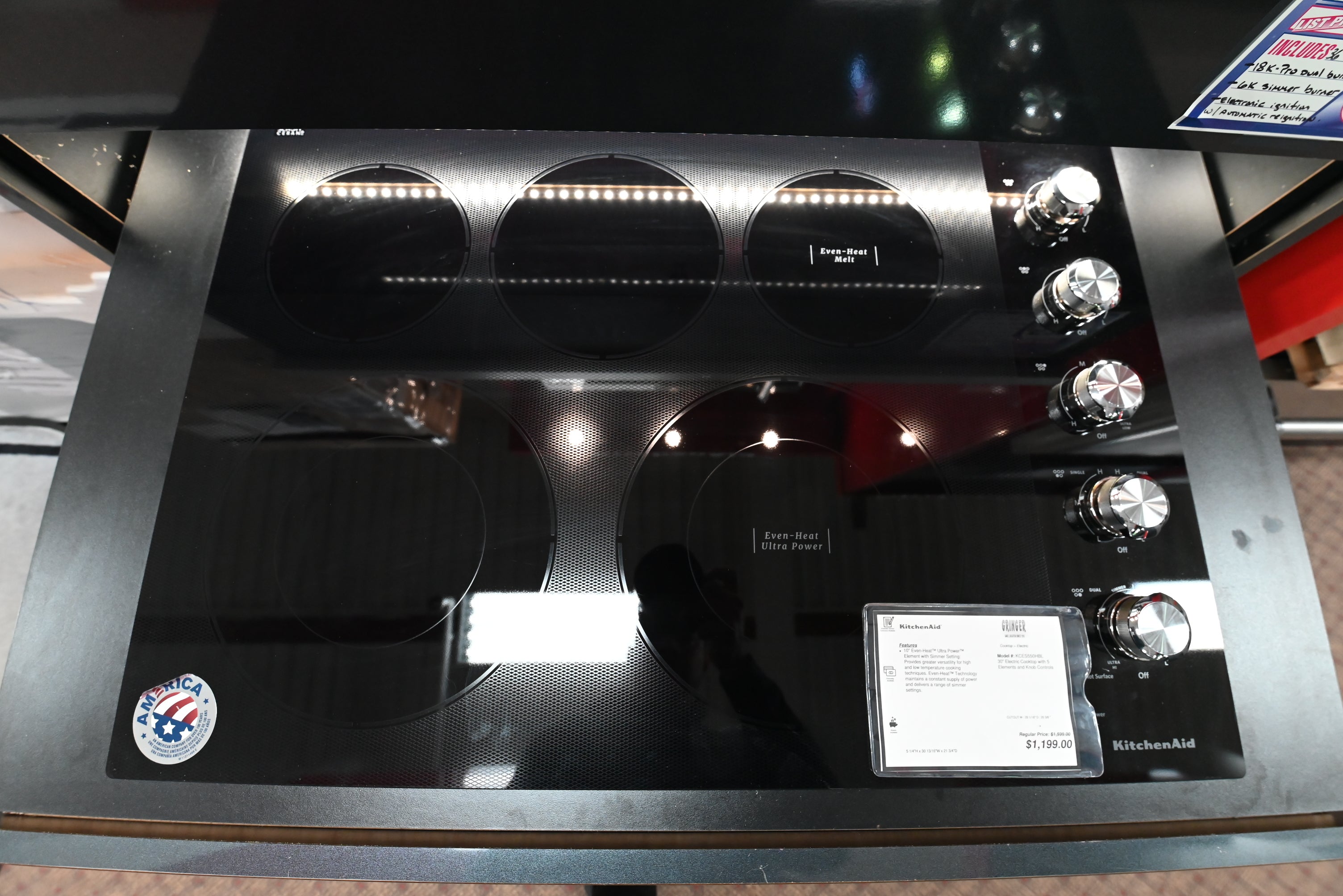 KitchenAid KCES550HBL 30 inch built in electric smoothtop cooktop in black glass front overhead view