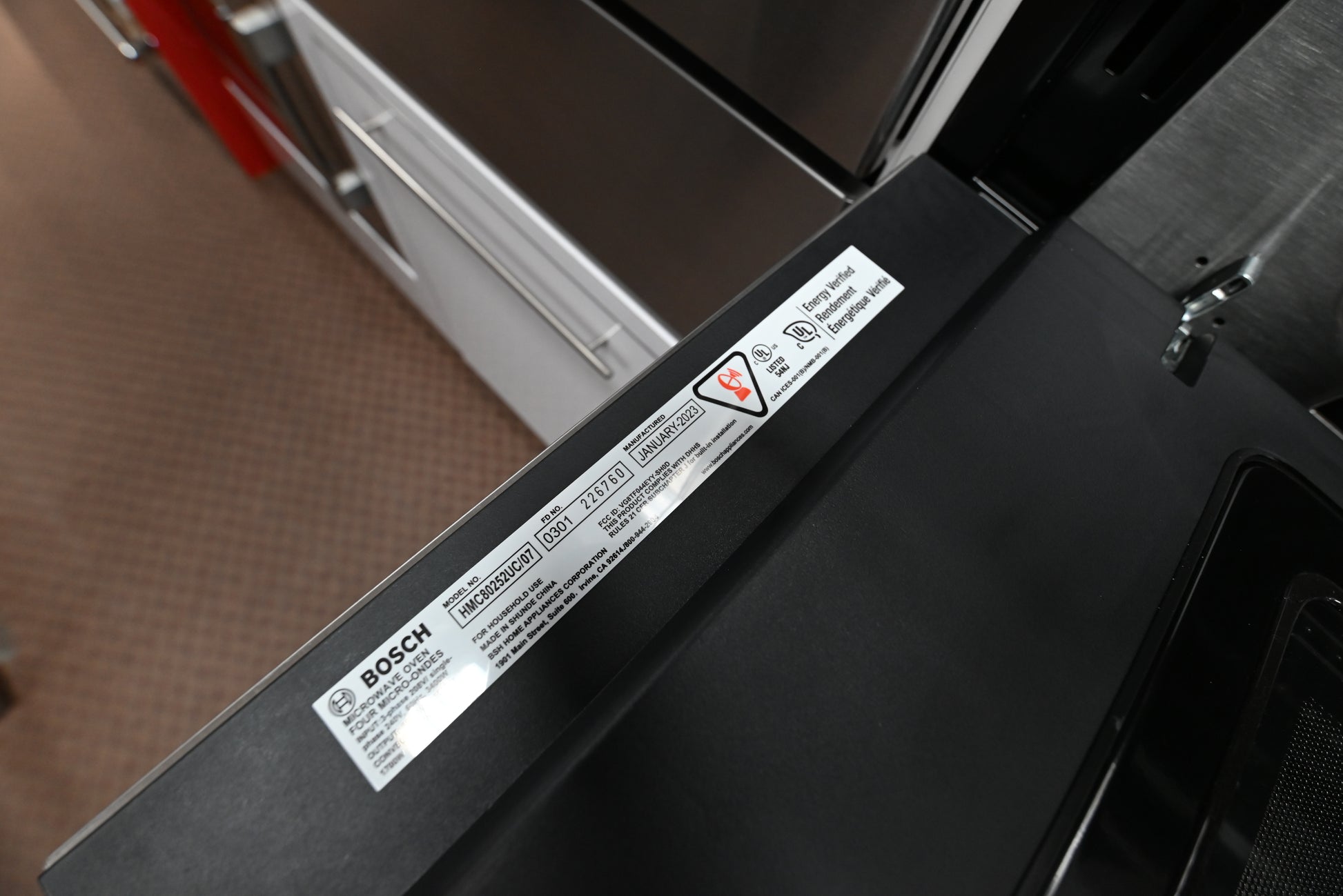 Bosch 30 speed oven installed flush vertically inside a kitchen tower cabinetry stack