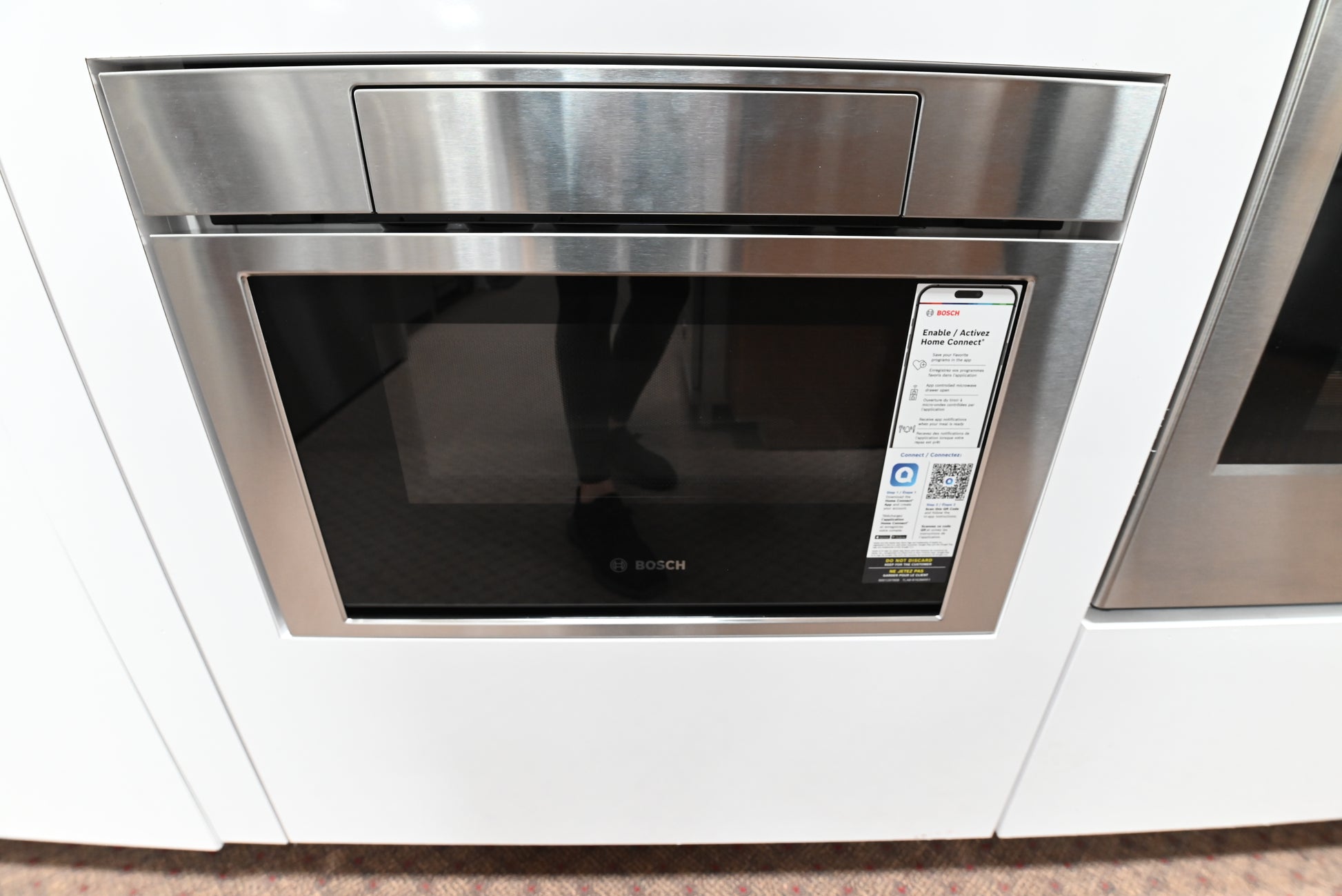 Luxury 24 inch integrated undercounter microwave drawer open showing turntable free layout
