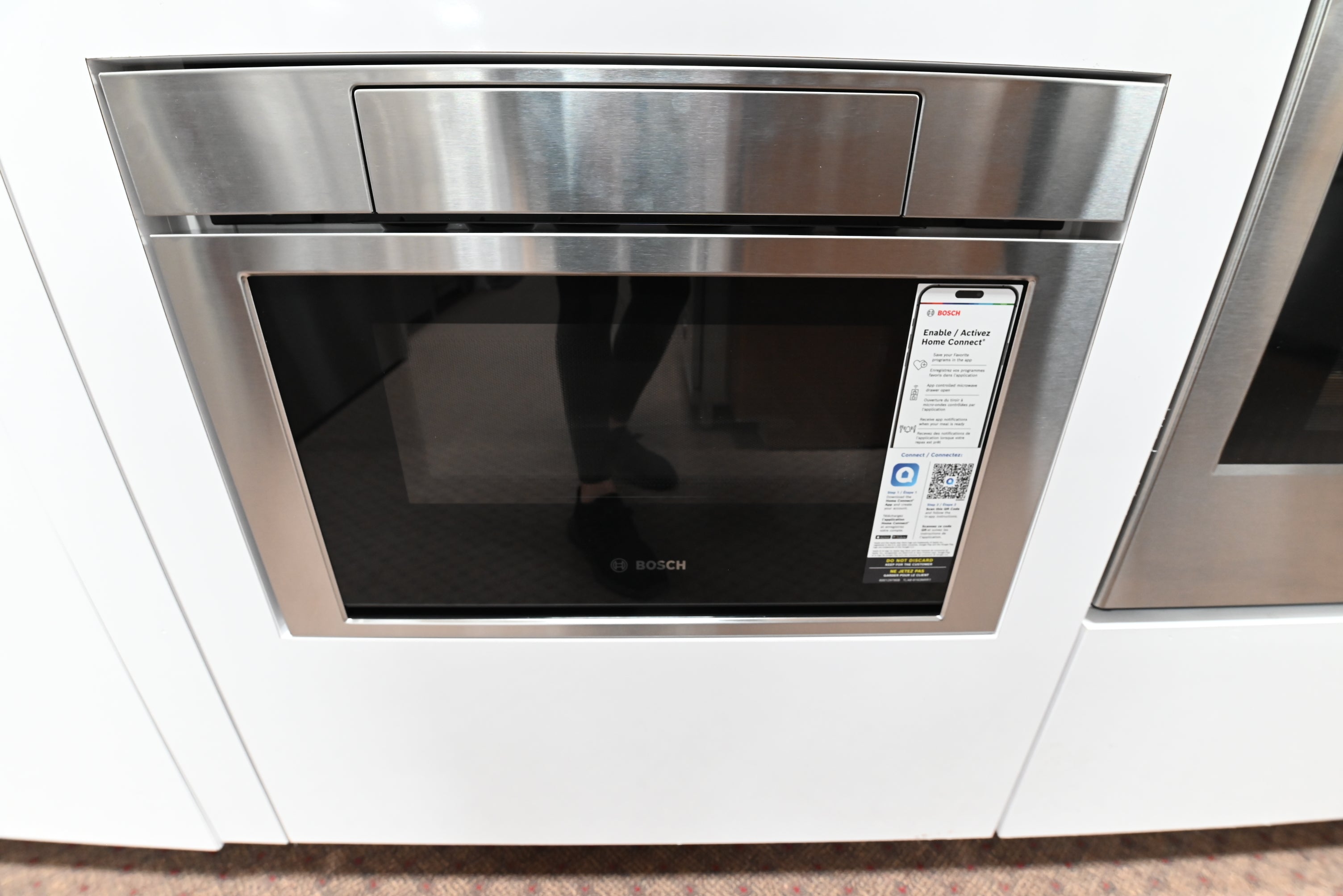Luxury 24 inch integrated undercounter microwave drawer open showing turntable free layout