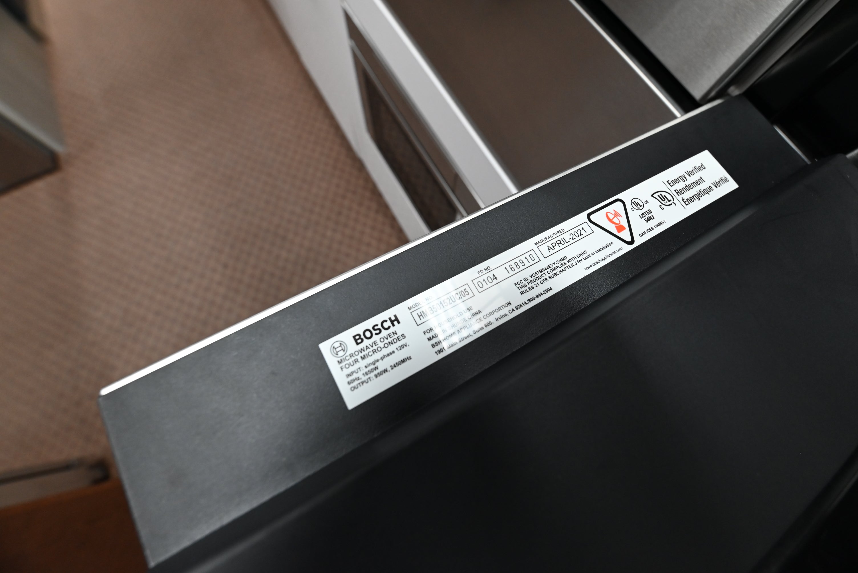 Bosch 30 combination wall oven close up showing heavy metal control knobs and digital clock