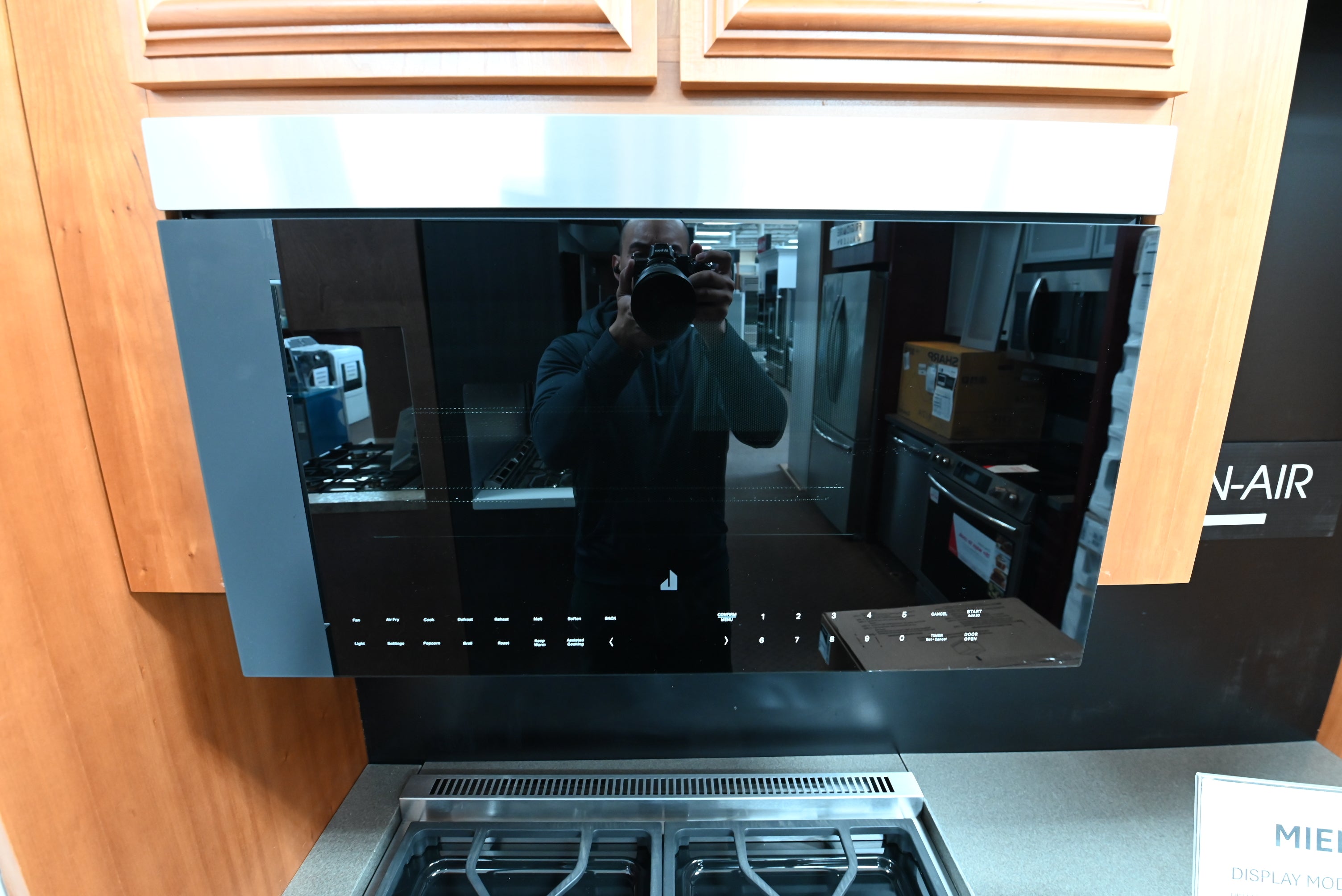 JennAir JMHF730RBL 30 inch flush over the range oven hood combination in black glass front profile
