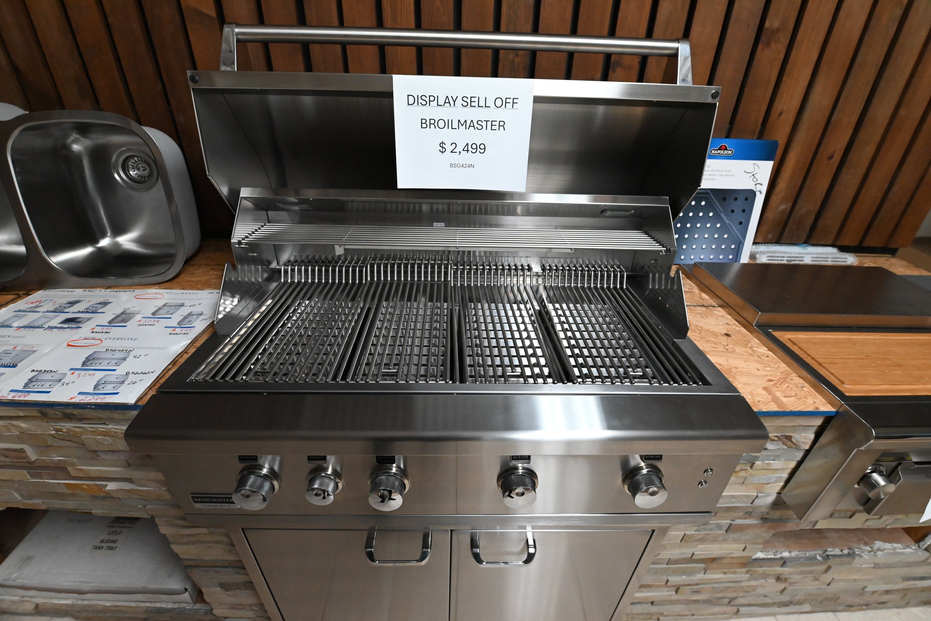 Luxury 42 inch outdoor built in grill open showing multi level grids and bow tie burners