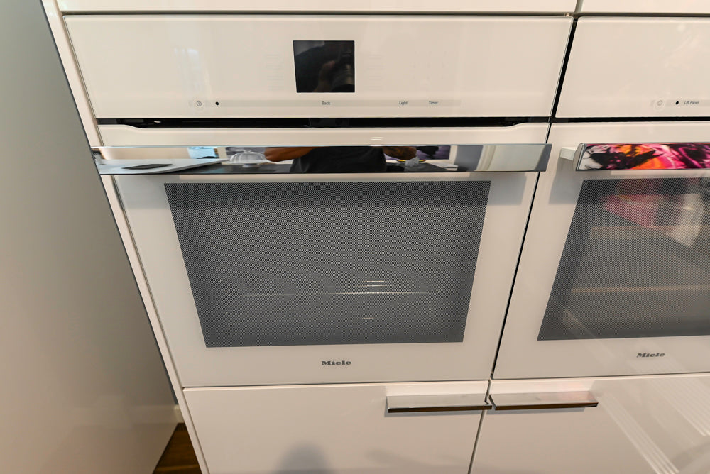 Poggenpohl Perfection: High Gloss White & Purple Modern Showroom Kitchen
