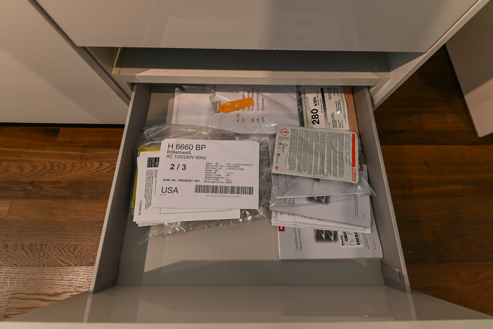 Poggenpohl Perfection: High Gloss White & Purple Modern Showroom Kitchen