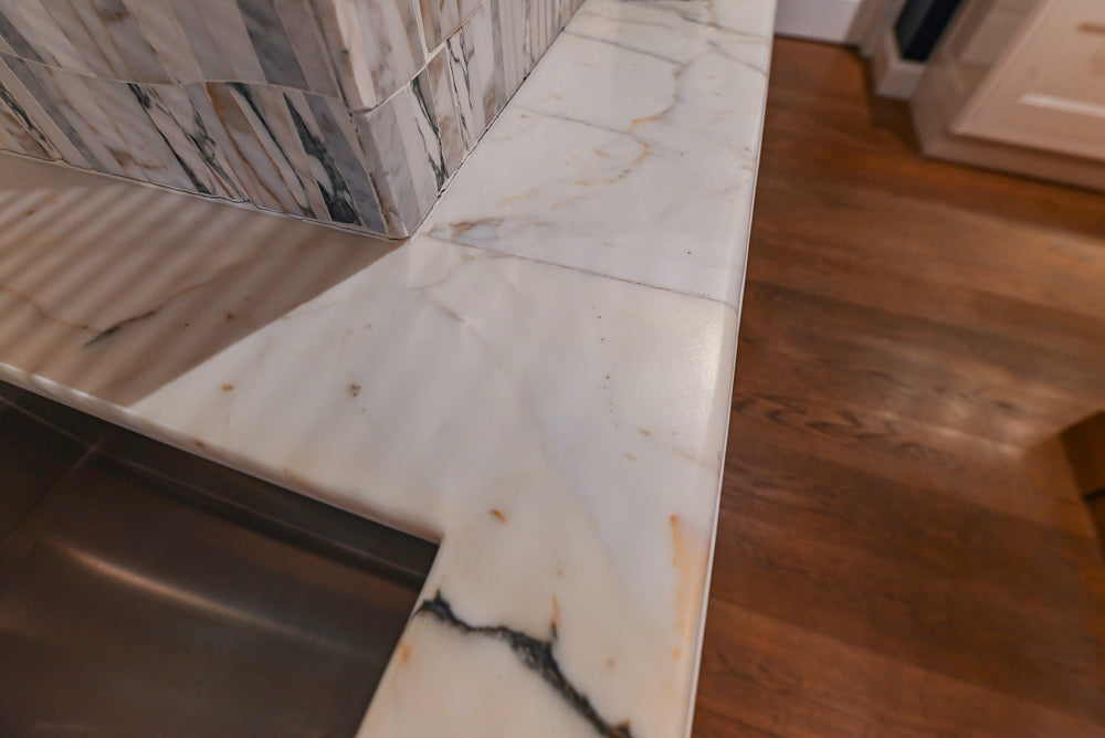 Christopher Peacock Refectory White Kitchen with Wooden Island, Marble Countertops and JennAir Appliances