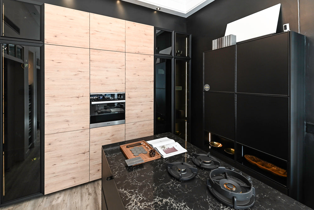 Nolte Küchen Modern Black Kitchen with Unique Accent Wall Cabinetry