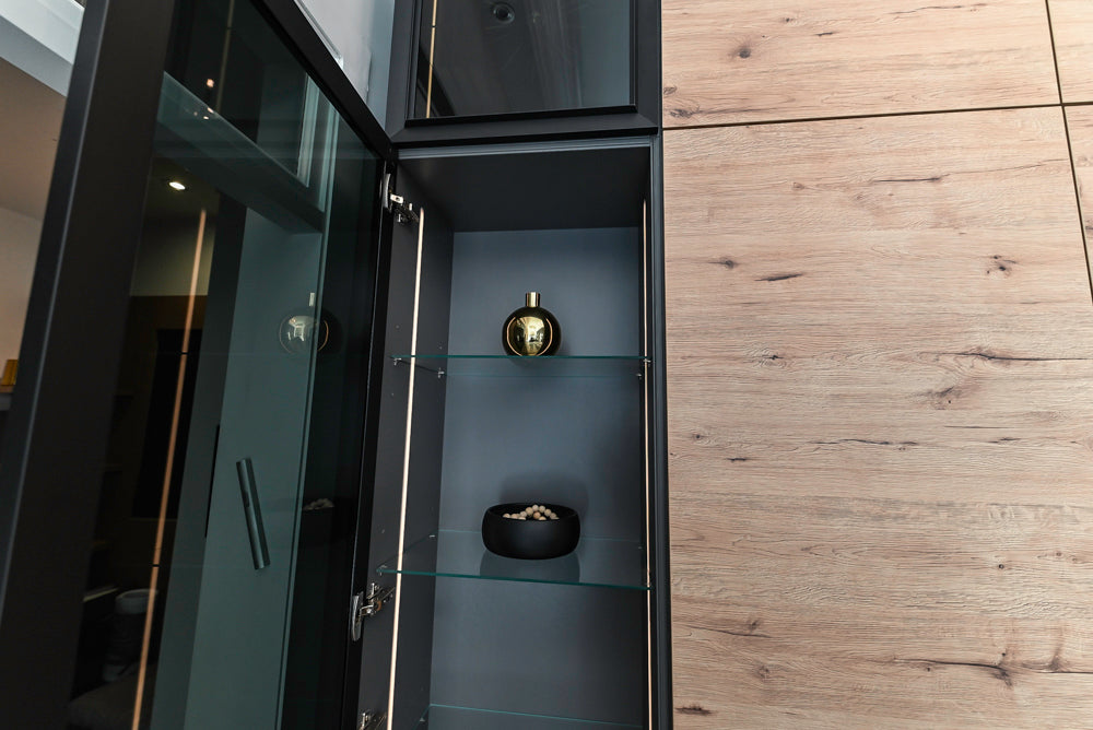 Nolte Küchen Modern Black Kitchen with Unique Accent Wall Cabinetry