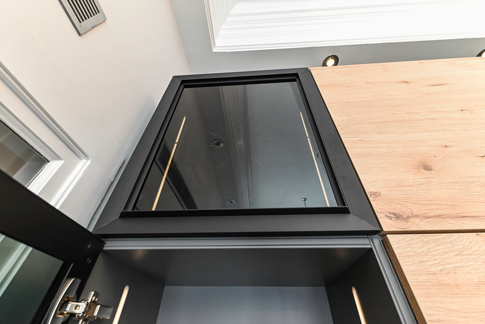 Nolte Küchen Modern Black Kitchen with Unique Accent Wall Cabinetry