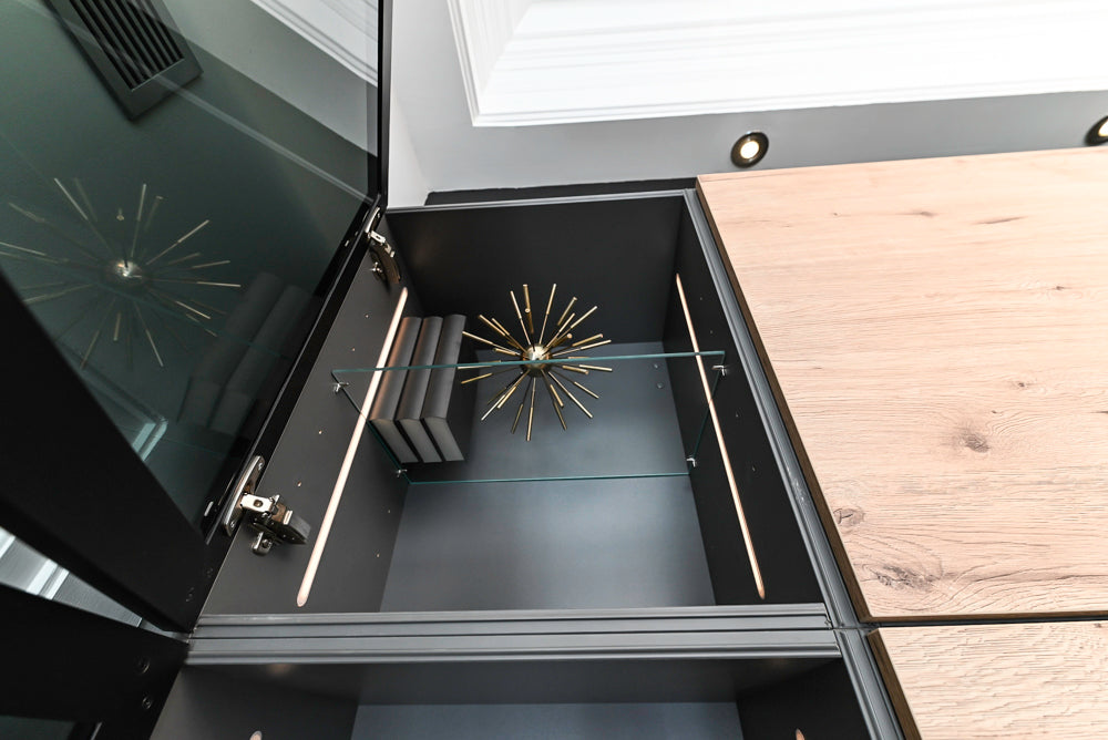 Nolte Küchen Modern Black Kitchen with Unique Accent Wall Cabinetry