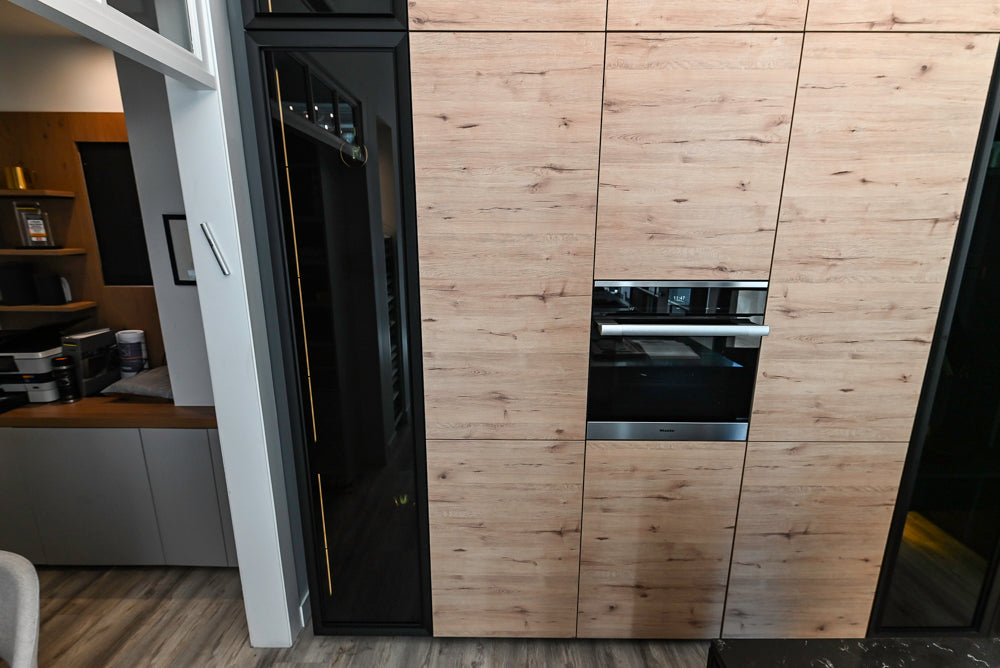 Nolte Küchen Modern Black Kitchen with Unique Accent Wall Cabinetry