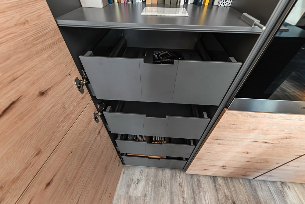 Nolte Küchen Modern Black Kitchen with Unique Accent Wall Cabinetry