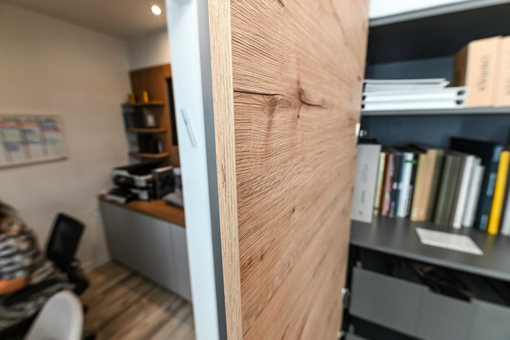 Nolte Küchen Modern Black Kitchen with Unique Accent Wall Cabinetry