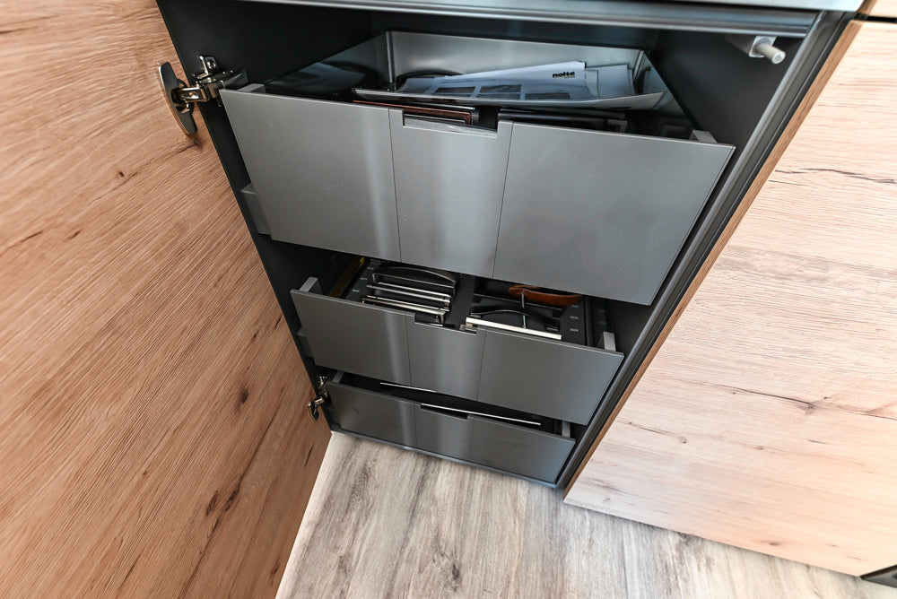 Nolte Küchen Modern Black Kitchen with Unique Accent Wall Cabinetry