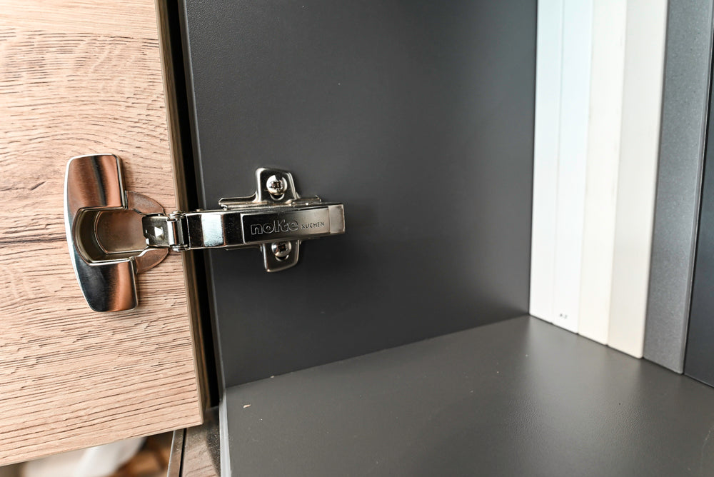 Nolte Küchen Modern Black Kitchen with Unique Accent Wall Cabinetry