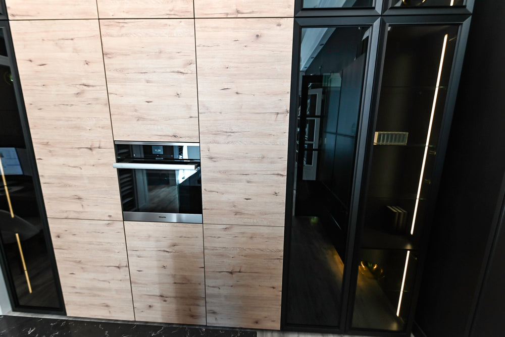 Nolte Küchen Modern Black Kitchen with Unique Accent Wall Cabinetry