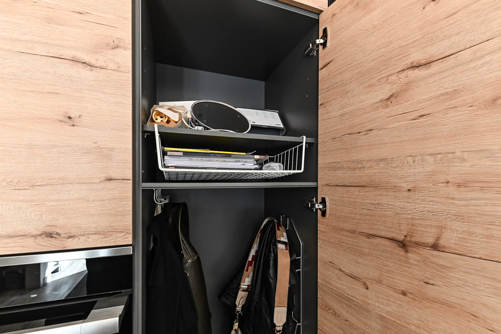 Nolte Küchen Modern Black Kitchen with Unique Accent Wall Cabinetry