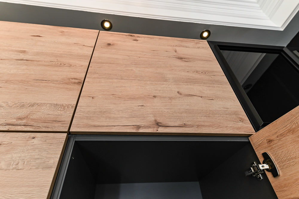 Nolte Küchen Modern Black Kitchen with Unique Accent Wall Cabinetry