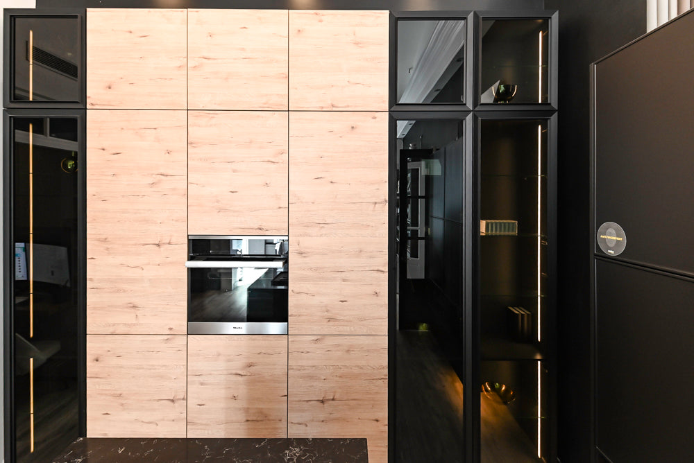 Nolte Küchen Modern Black Kitchen with Unique Accent Wall Cabinetry