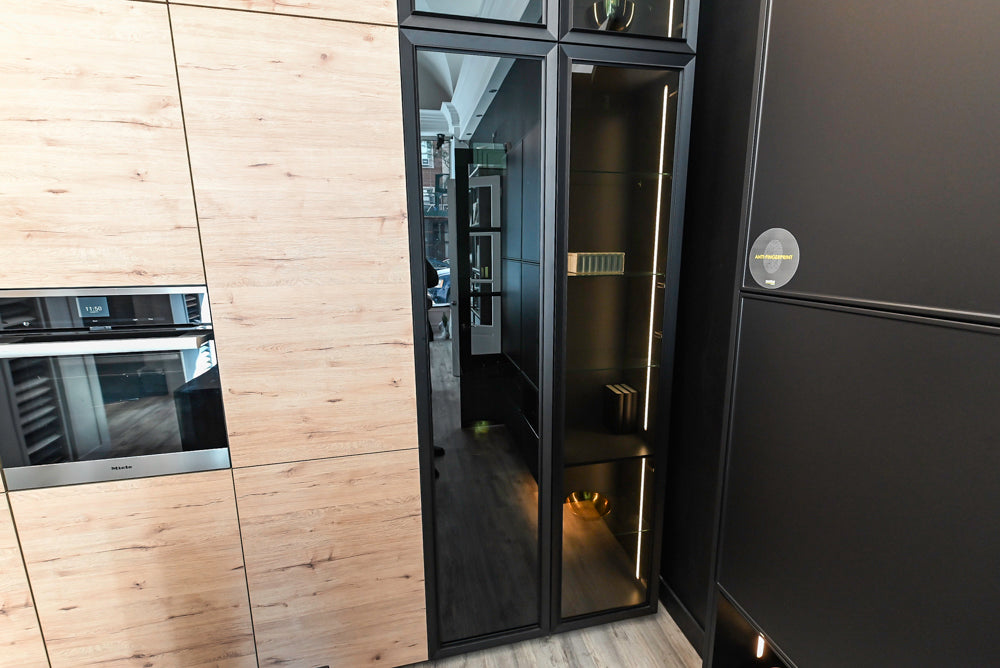 Nolte Küchen Modern Black Kitchen with Unique Accent Wall Cabinetry