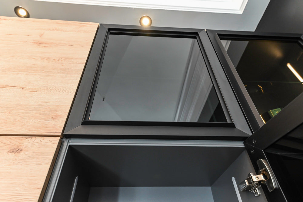 Nolte Küchen Modern Black Kitchen with Unique Accent Wall Cabinetry