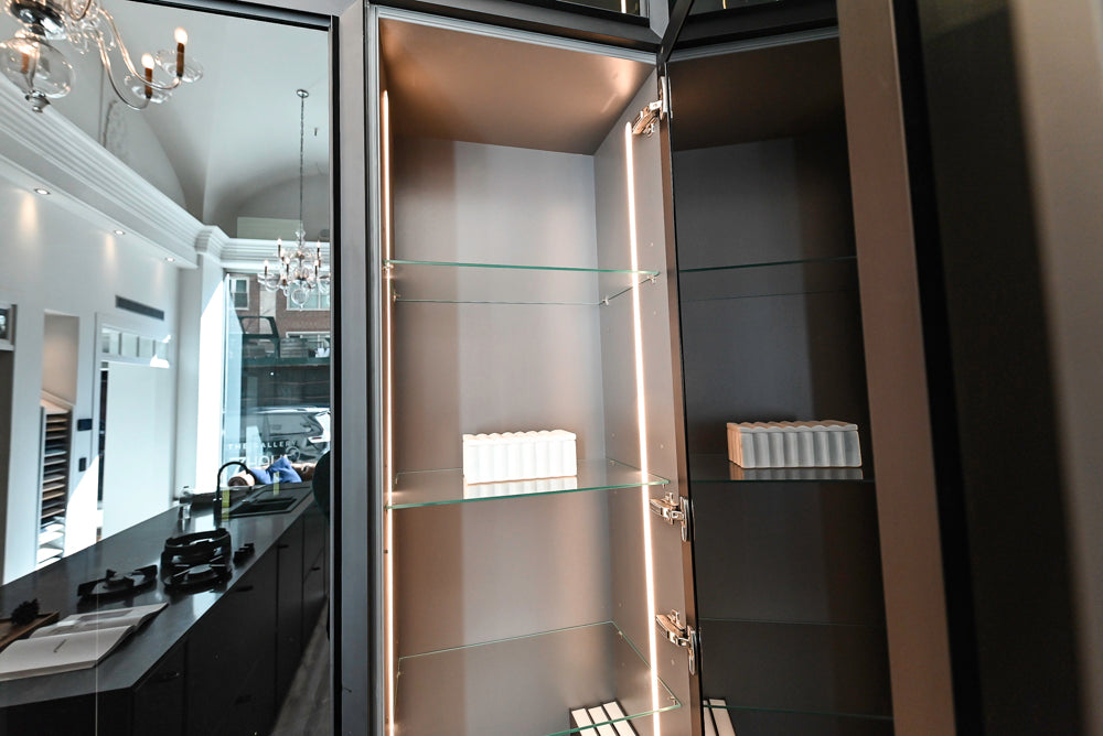 Nolte Küchen Modern Black Kitchen with Unique Accent Wall Cabinetry