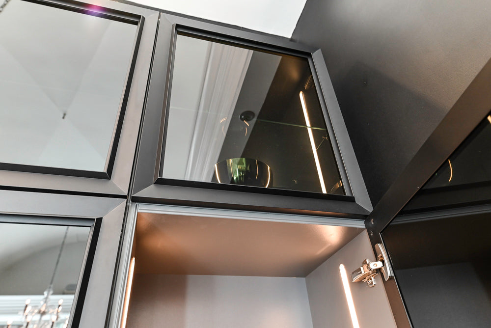 Nolte Küchen Modern Black Kitchen with Unique Accent Wall Cabinetry
