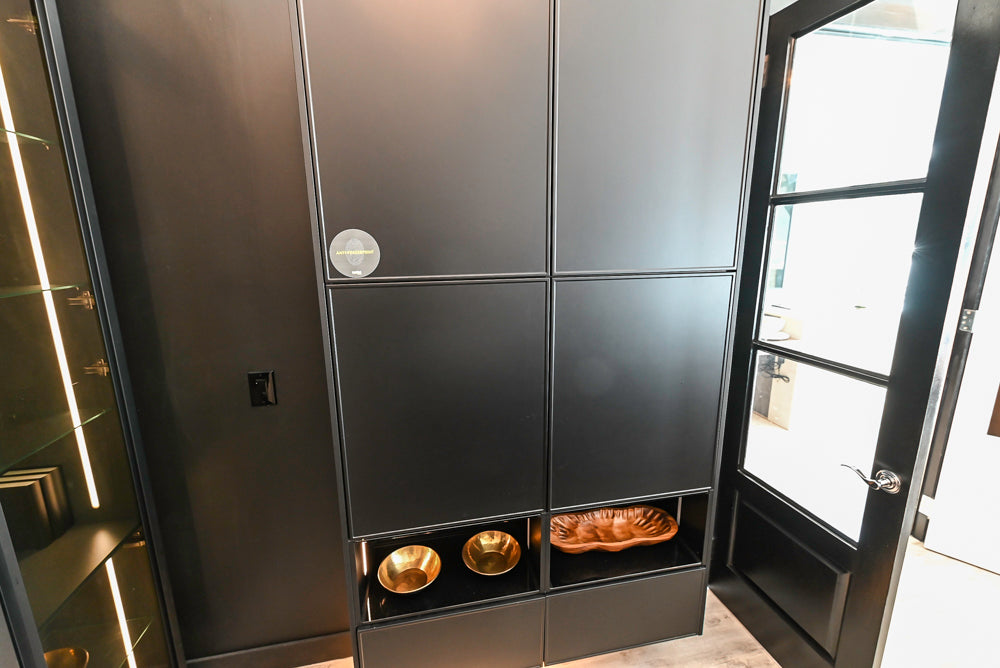 Nolte Küchen Modern Black Kitchen with Unique Accent Wall Cabinetry