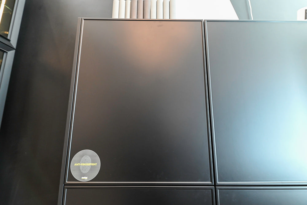 Nolte Küchen Modern Black Kitchen with Unique Accent Wall Cabinetry