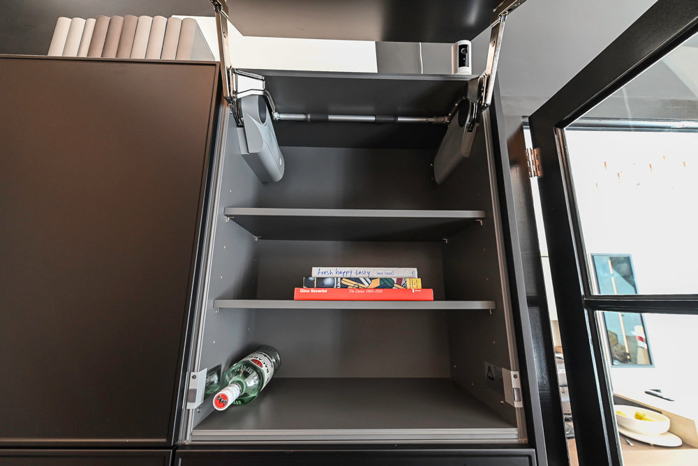 Nolte Küchen Modern Black Kitchen with Unique Accent Wall Cabinetry
