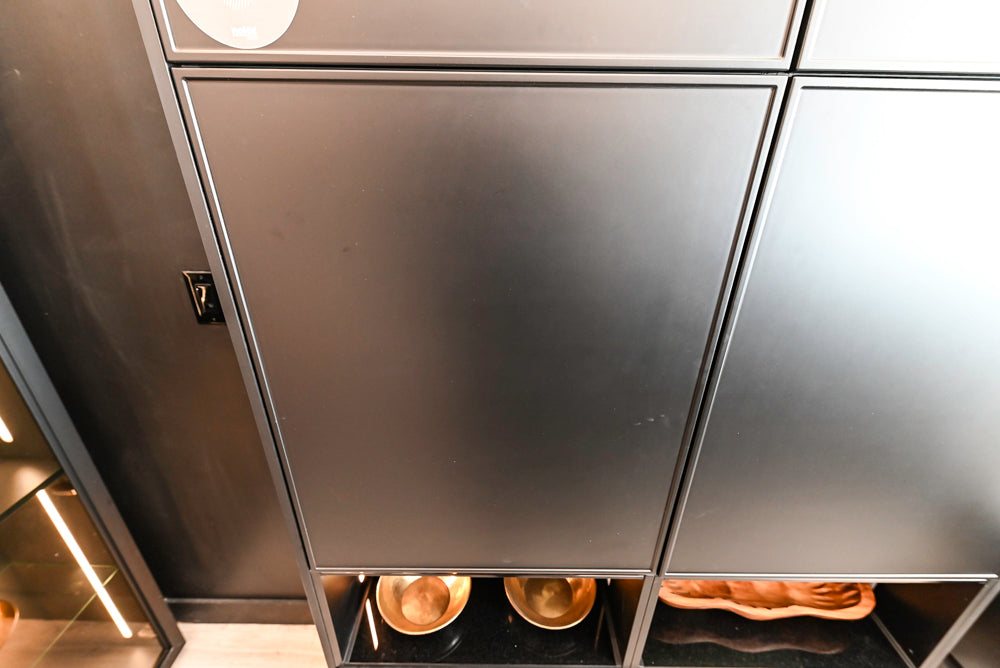 Nolte Küchen Modern Black Kitchen with Unique Accent Wall Cabinetry