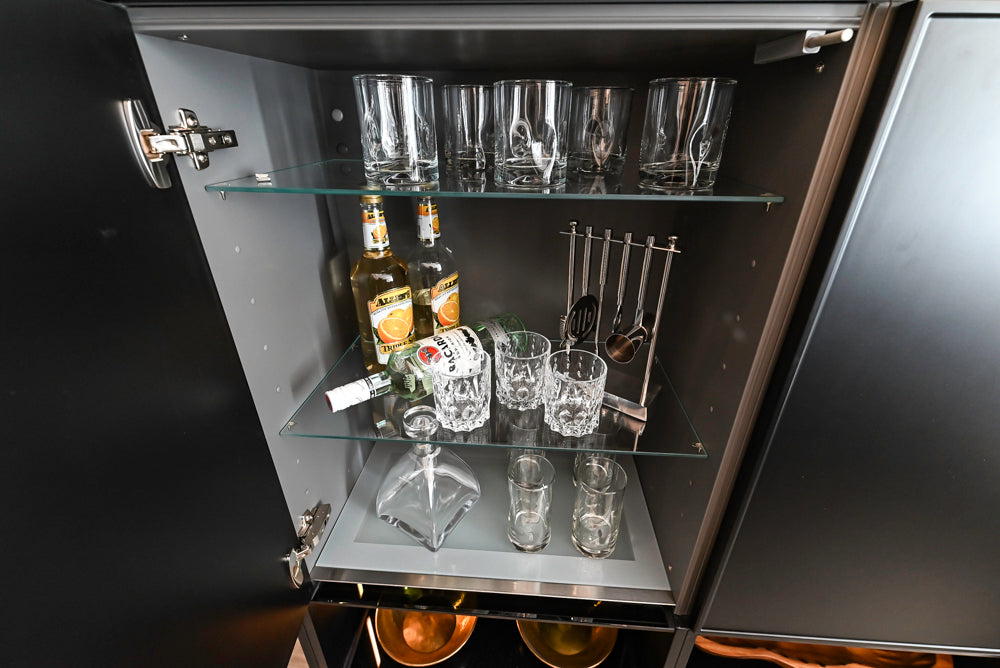 Nolte Küchen Modern Black Kitchen with Unique Accent Wall Cabinetry